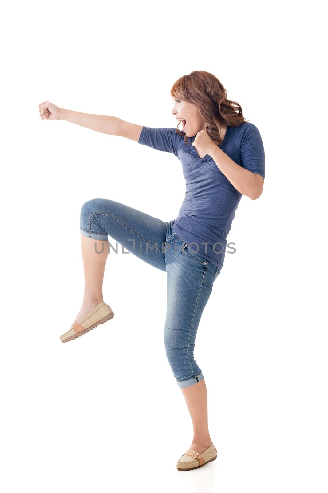 Fighting Asian woman, full length portrait isolated.