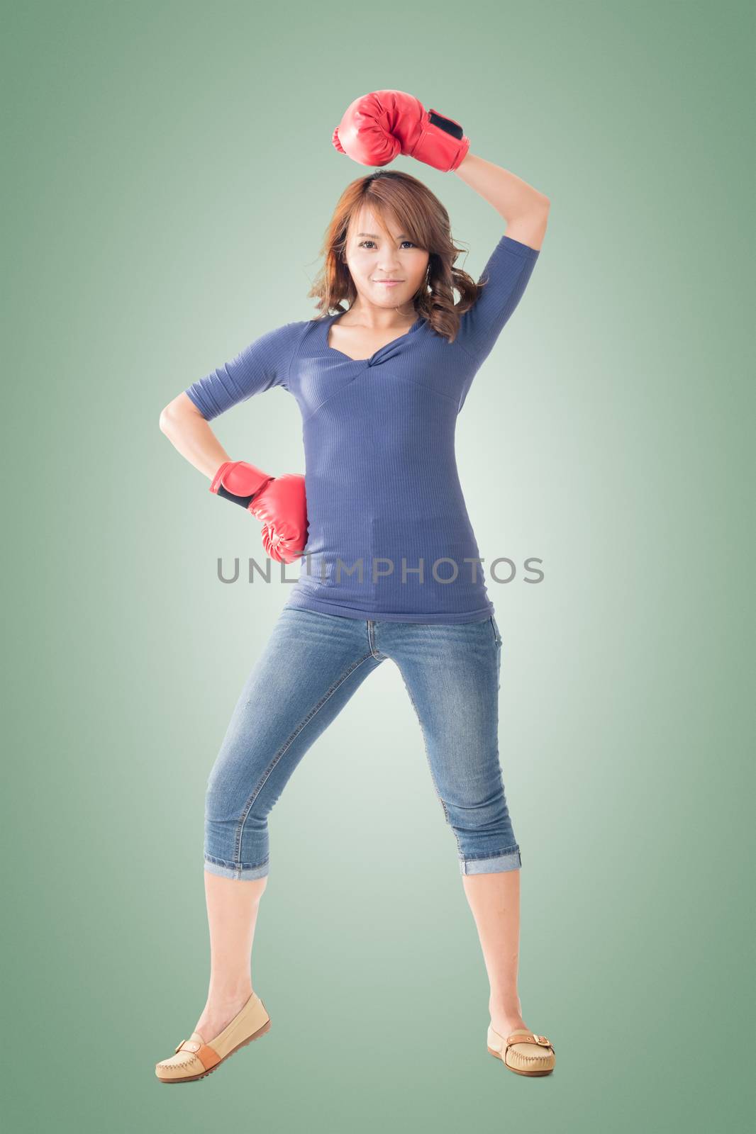 Fighting girl concept, rear view full length portrait of Asian isolated.