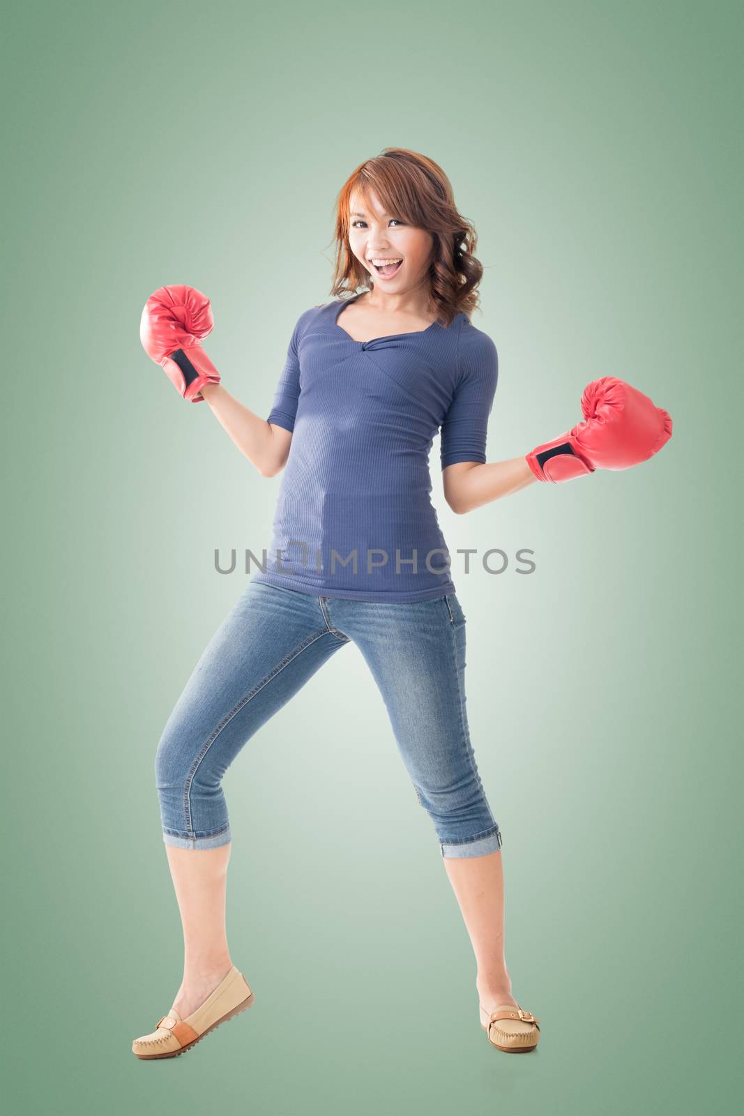 Fighting girl concept, rear view full length portrait of Asian isolated.