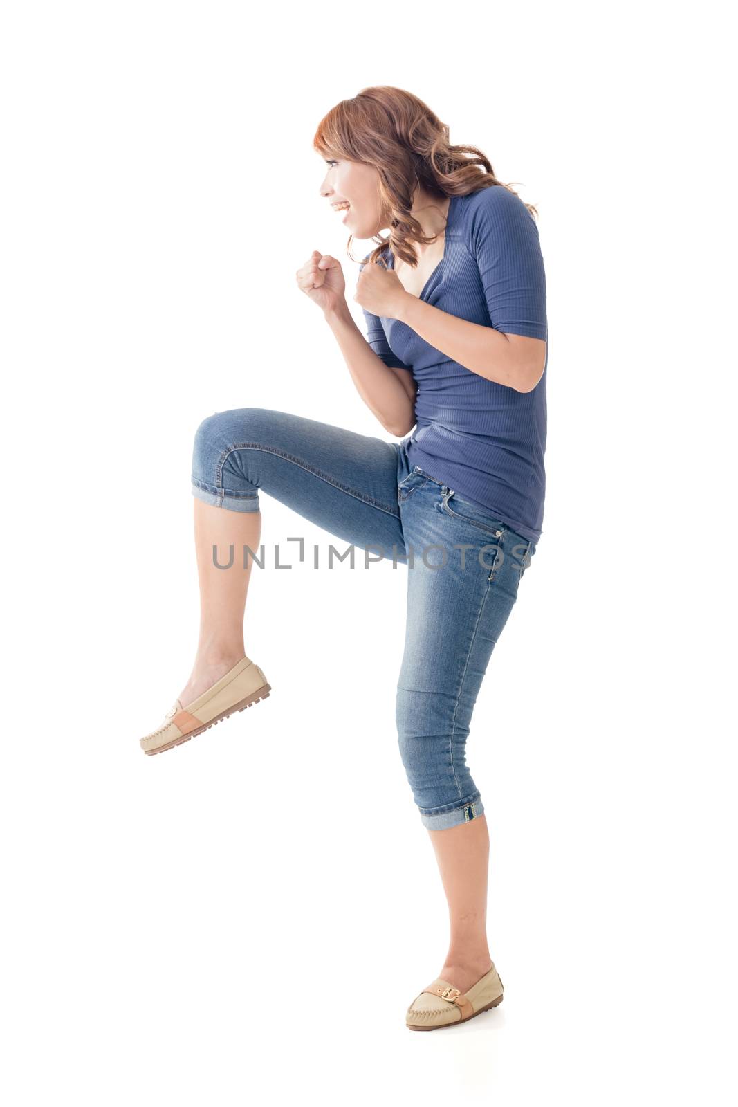 Fighting Asian woman, full length portrait isolated.