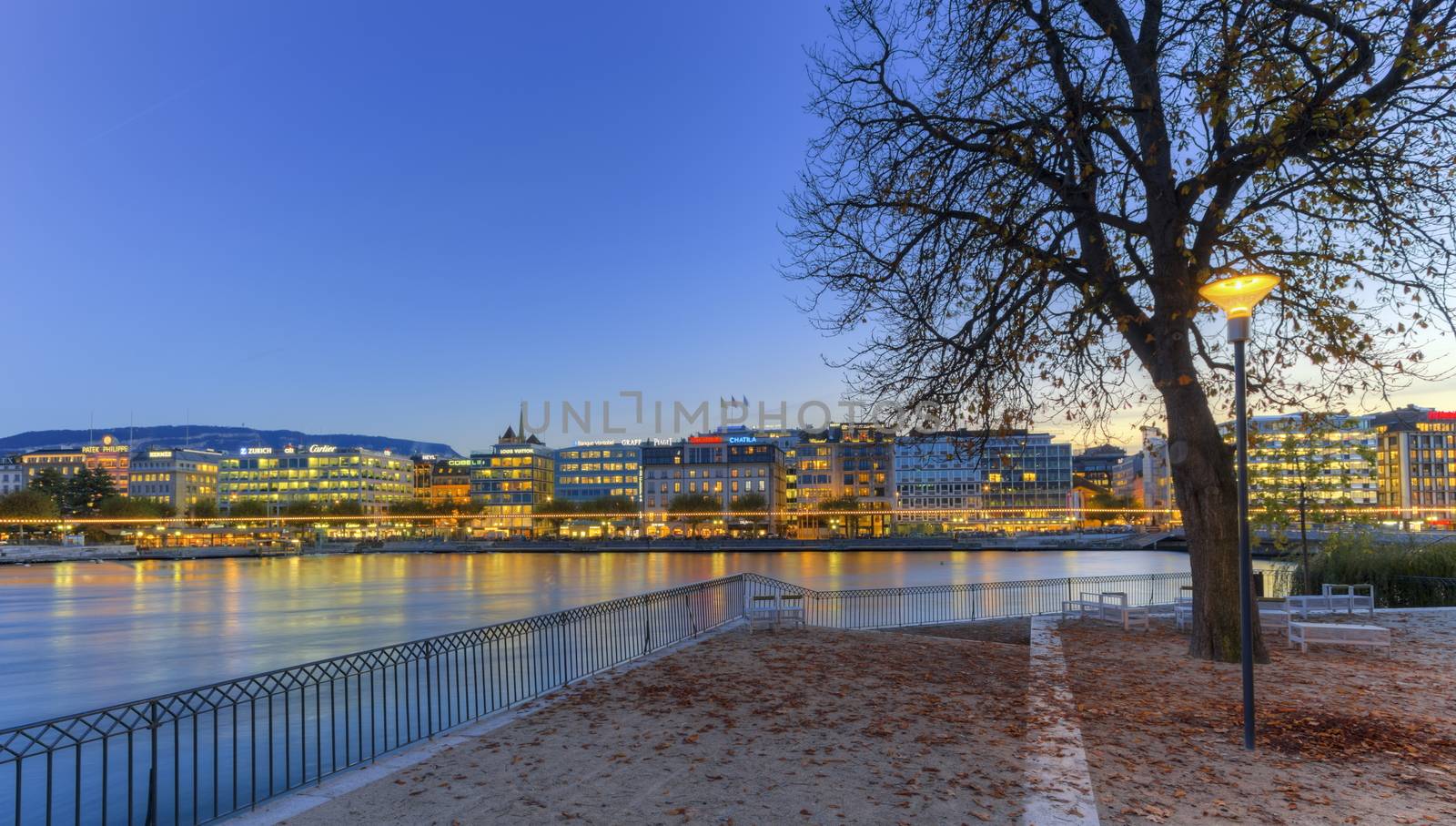 GENEVA, SWITZERLAND - NOVEMBER 13, 2014 : Geneva riverside from Rousseau island by night, Switzerland, HDR