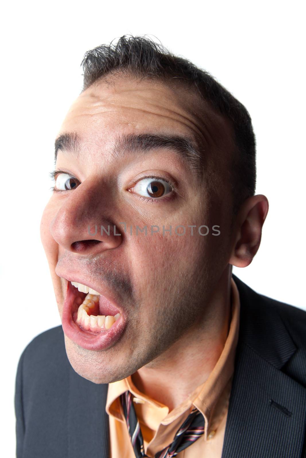 Shocked or surprised looking young business man isolated over white.