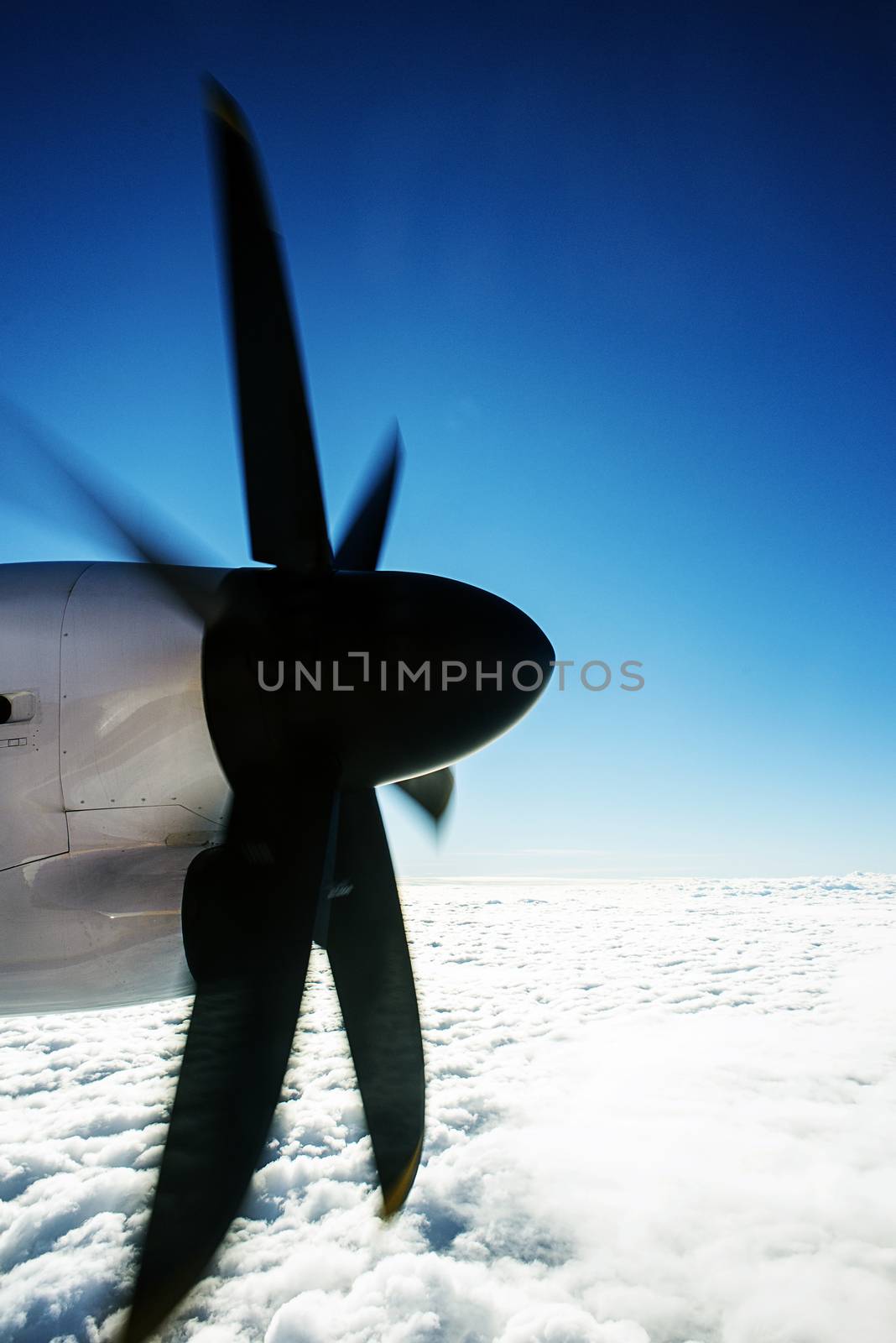 Defocused and blurred image Airplane propeller engine against on sky