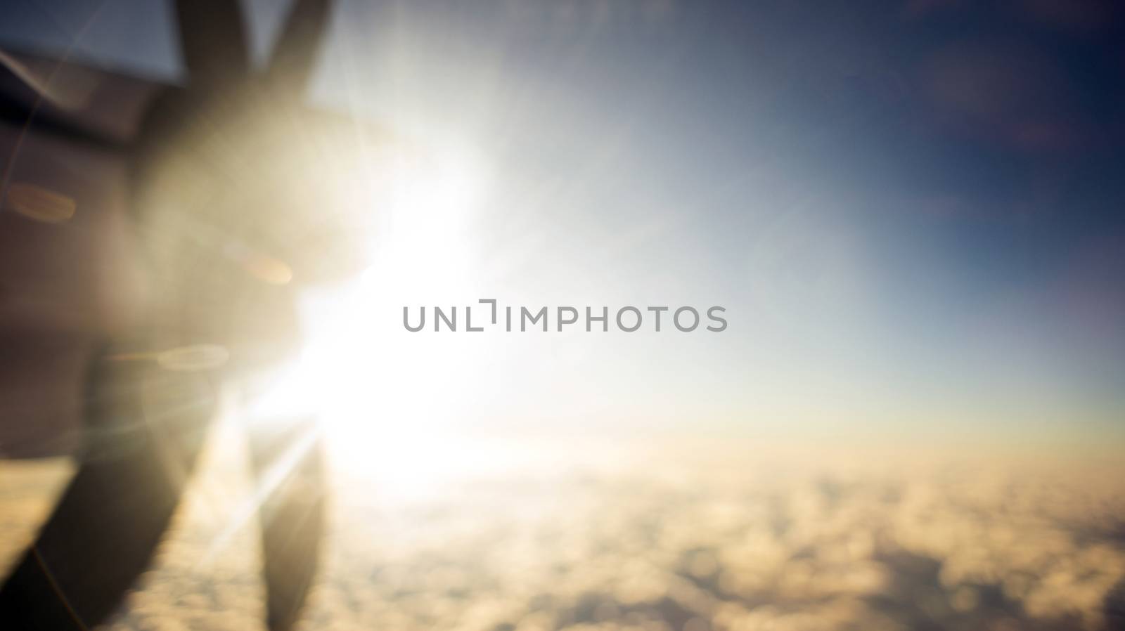 Defocused and blurred image Airplane propeller engine against on sky