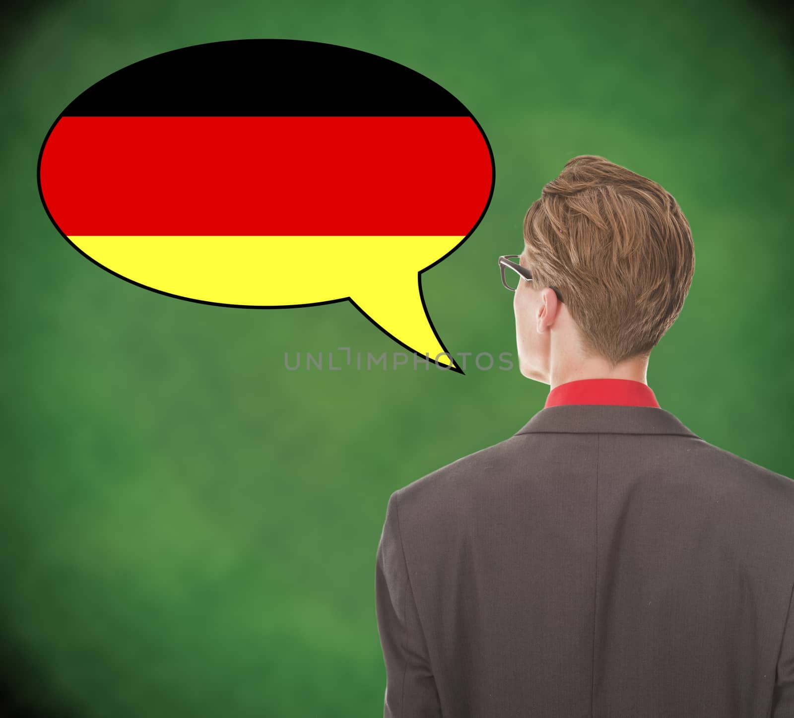 Young business man speaking german on school board background