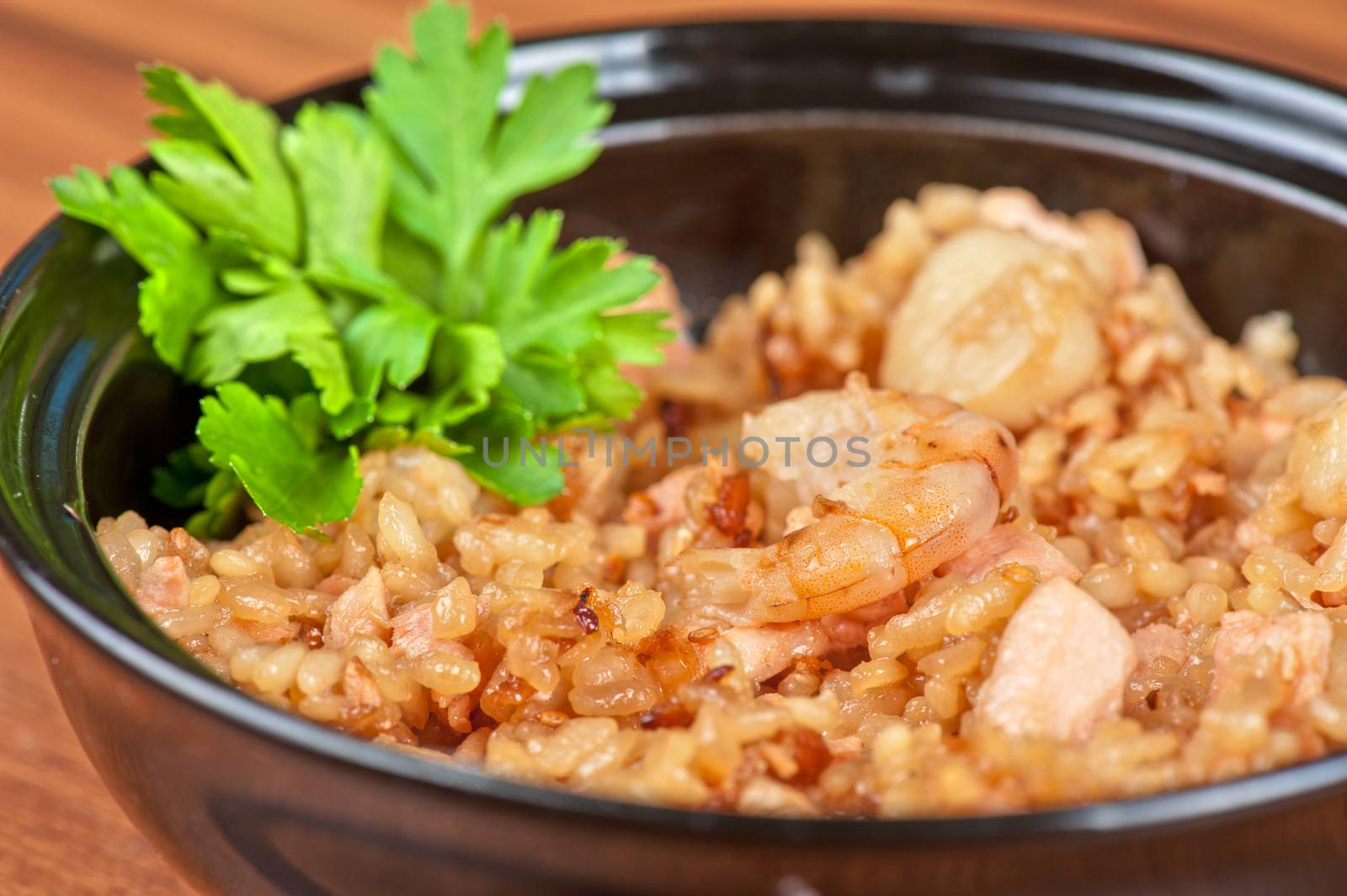 Shrimps risotto garnished with fresh parsley