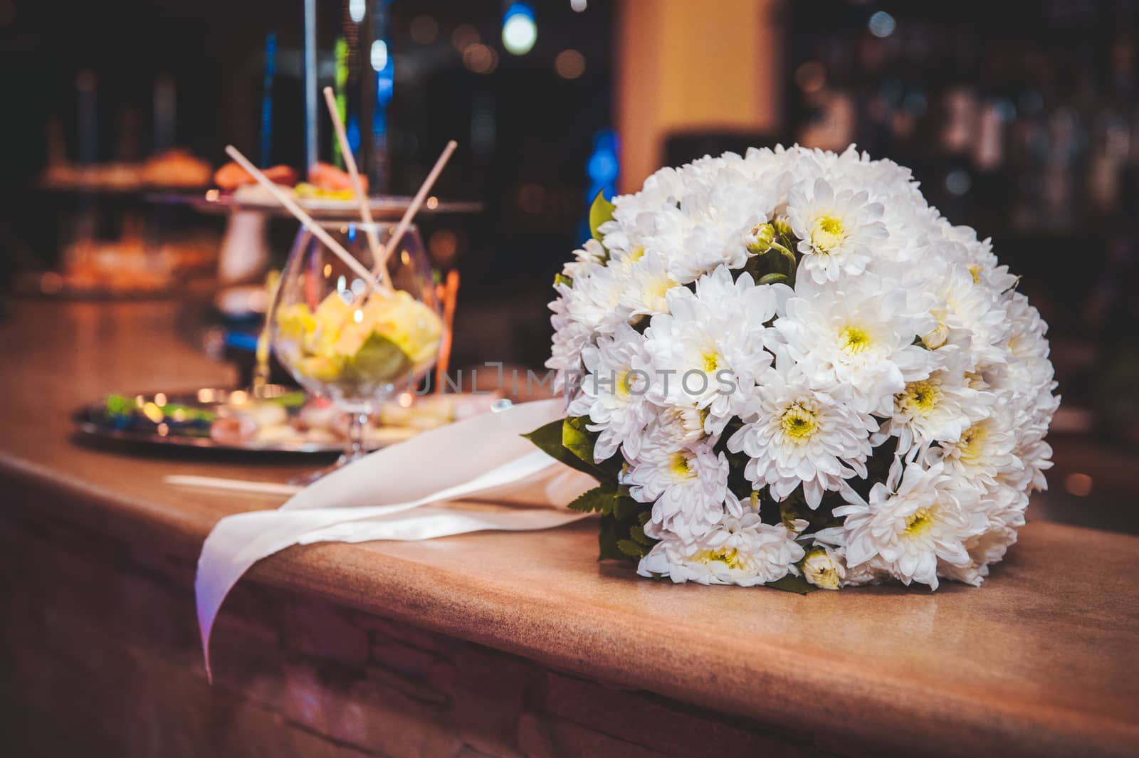 beautiful white wedding bouquet with white ribbon