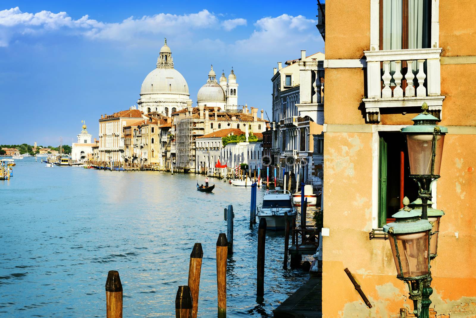 Gorgeous view of the Grand Canal and Basilica Santa Maria della Salute during sunset with interesting clouds, Venice, Italy