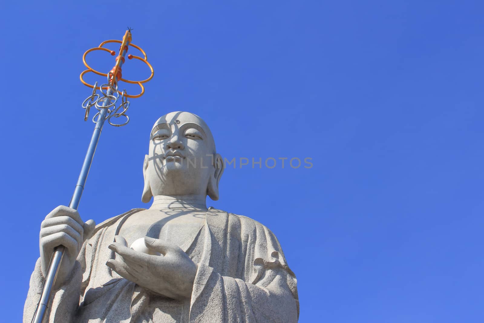 Big Buddha Priest Chinese Style with Blue Sky at Donwai Temple, Nakornpathom, Thailand on February 2014 