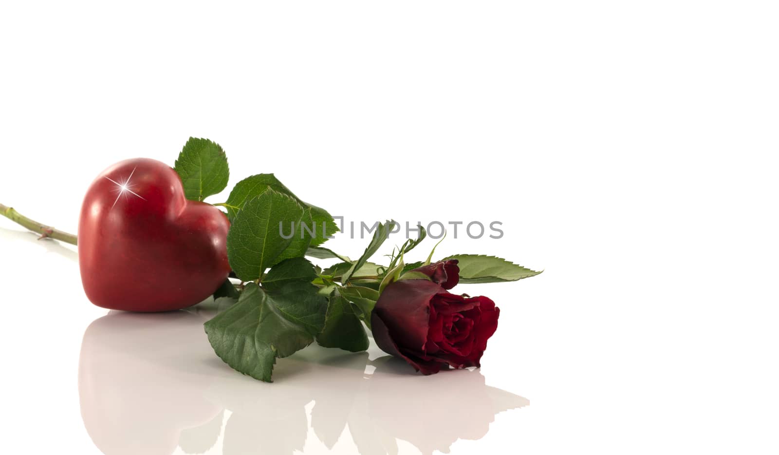 red rose with heart shape by compuinfoto