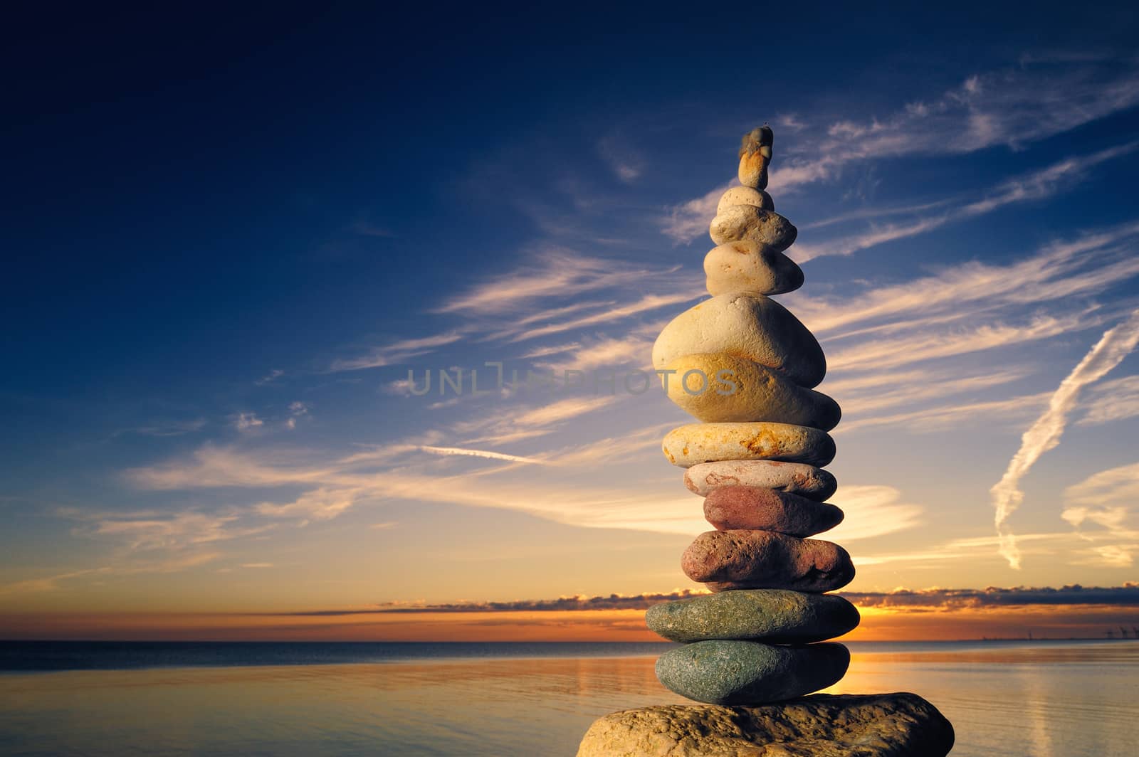 Pyramidal stack of pebbles on the shore
