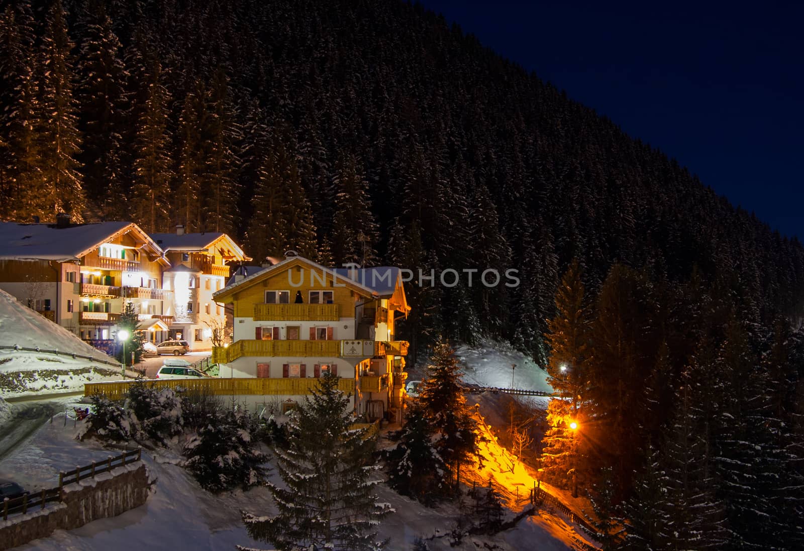 Night view at the ski resort at the mountain slopes (Dolomites, Italy)