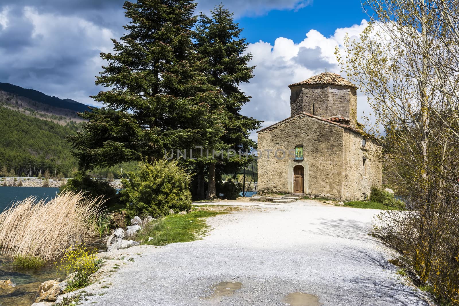 Orthodox Church next to Lake by ankarb