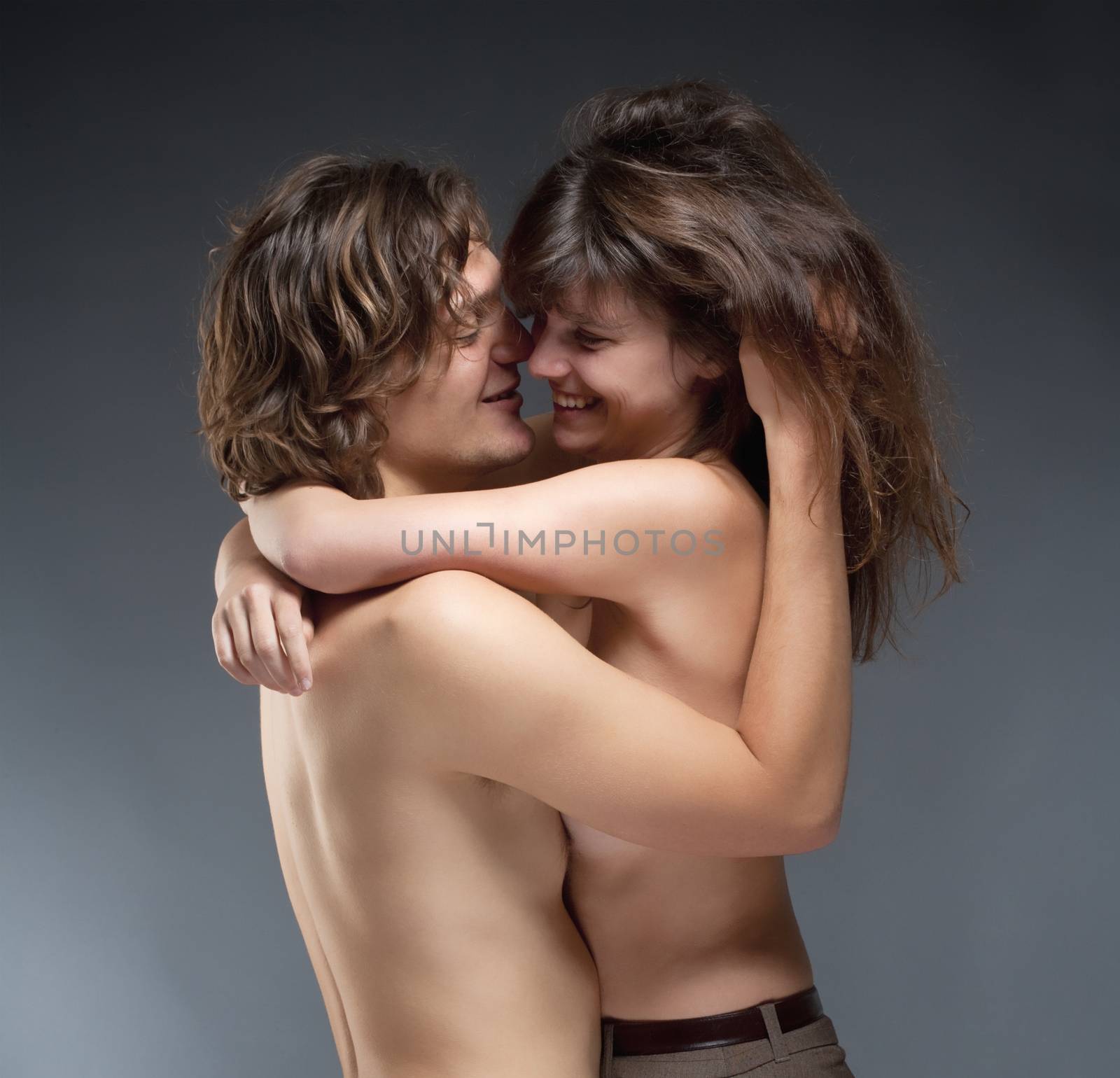 Portrait of a Young Romantic Couple Embracing, Smiling