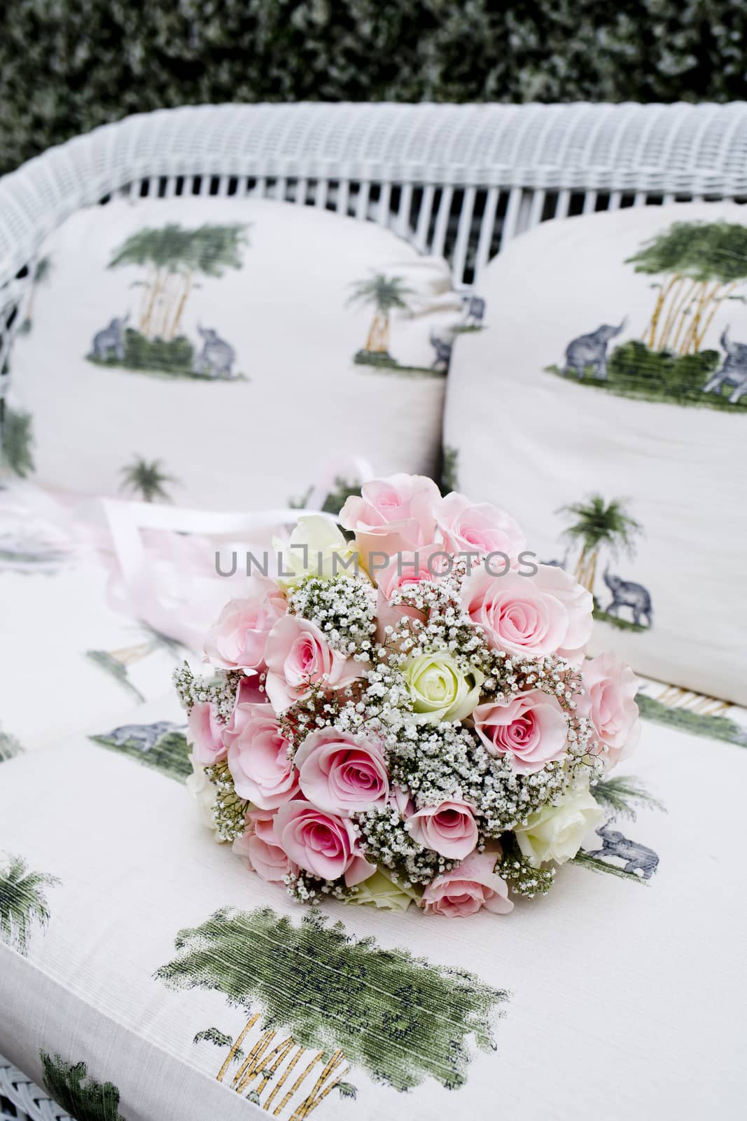 Bouquet of pink roses on sofa by art9858