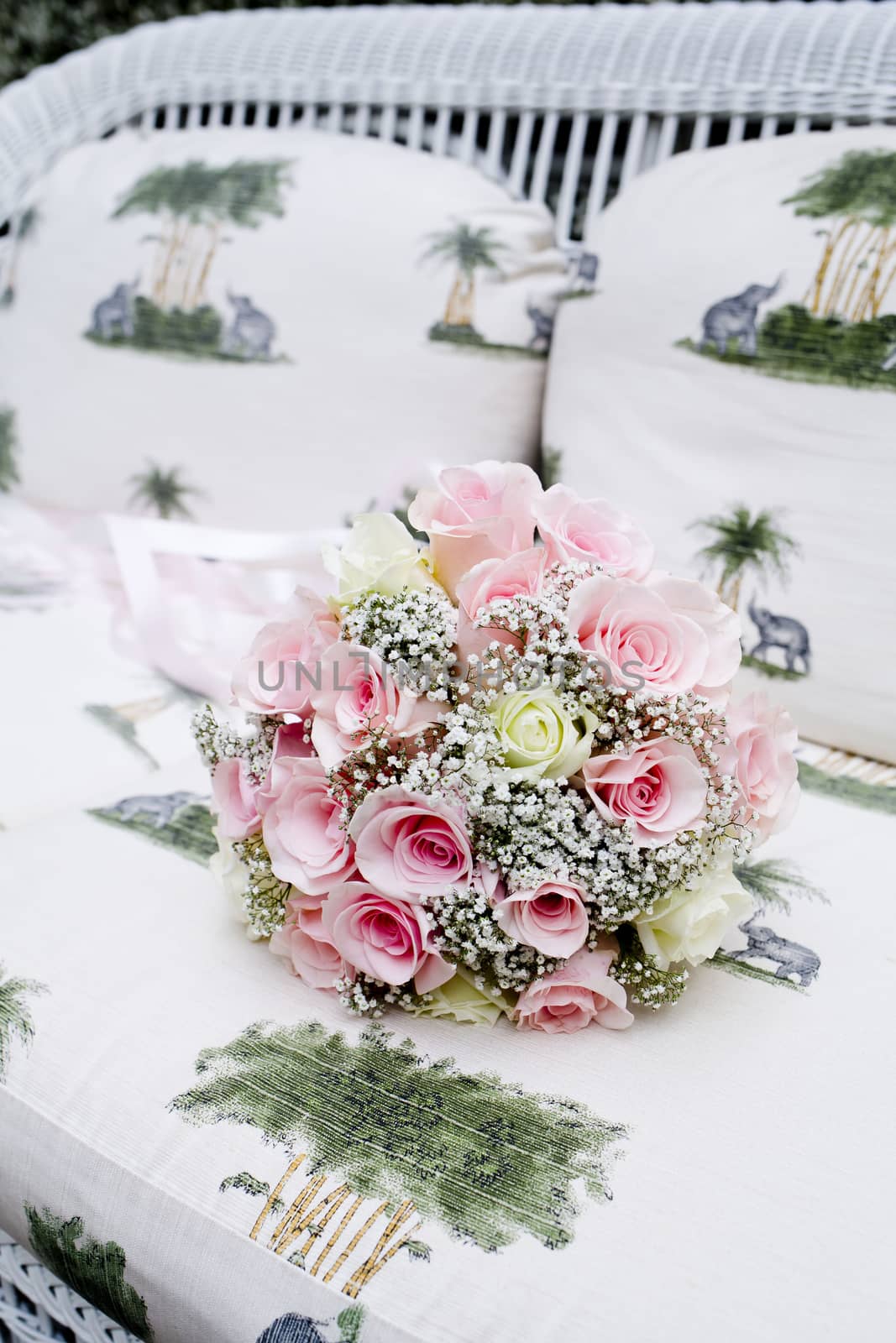 Bouquet of pink roses on sofa by art9858