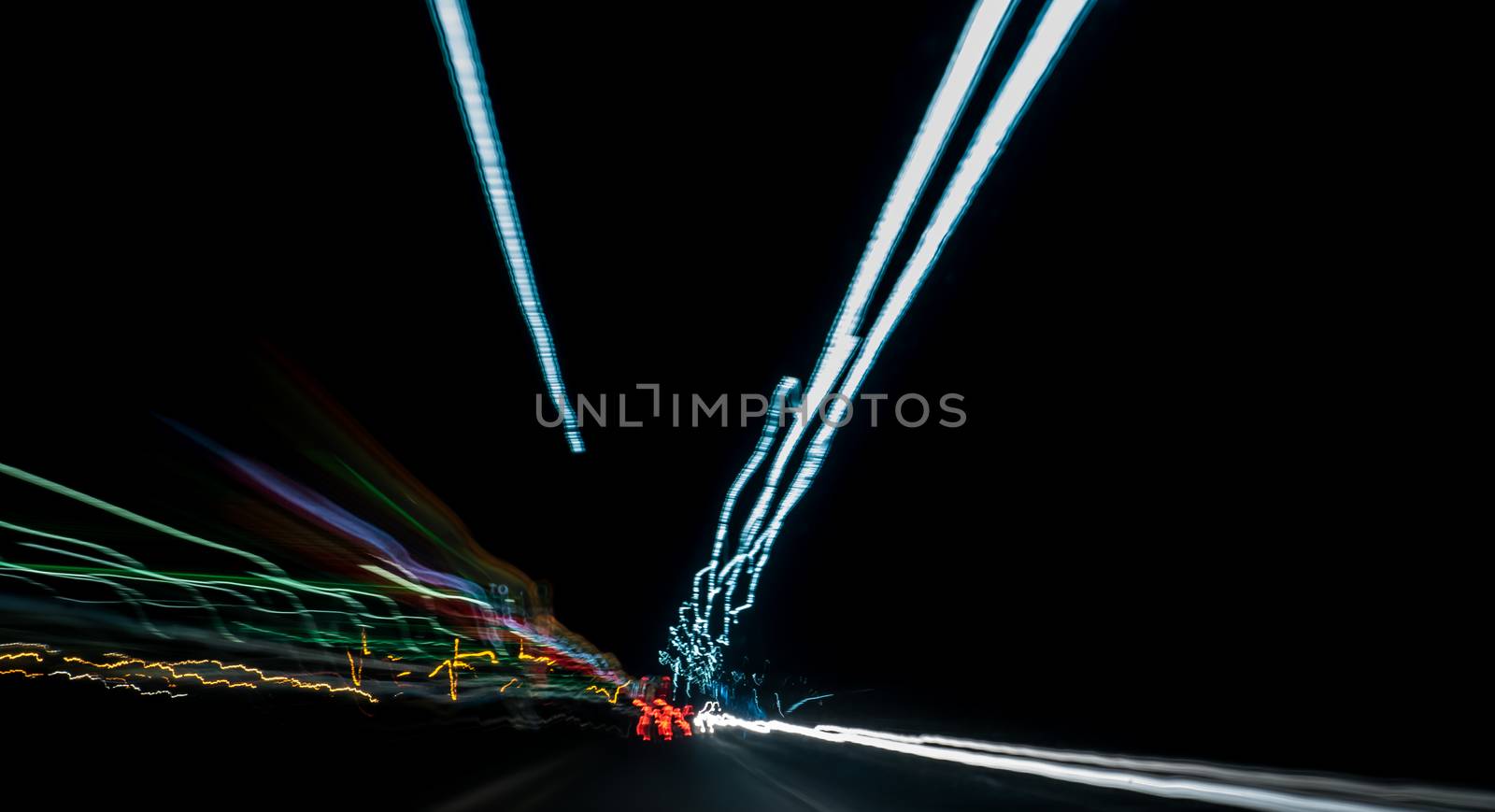 Colored abstract car lights at night on motorway