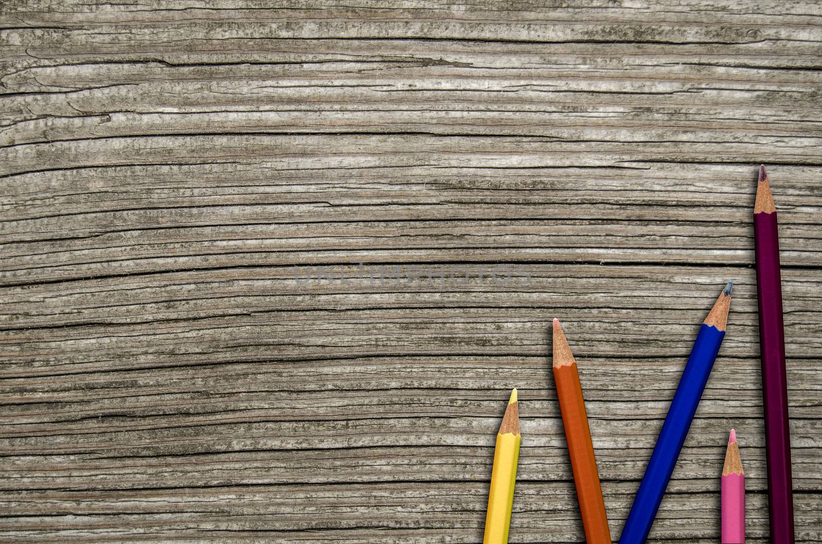 Back To School Image Of Some Colored Pencils On A Rustic Wooden Desk