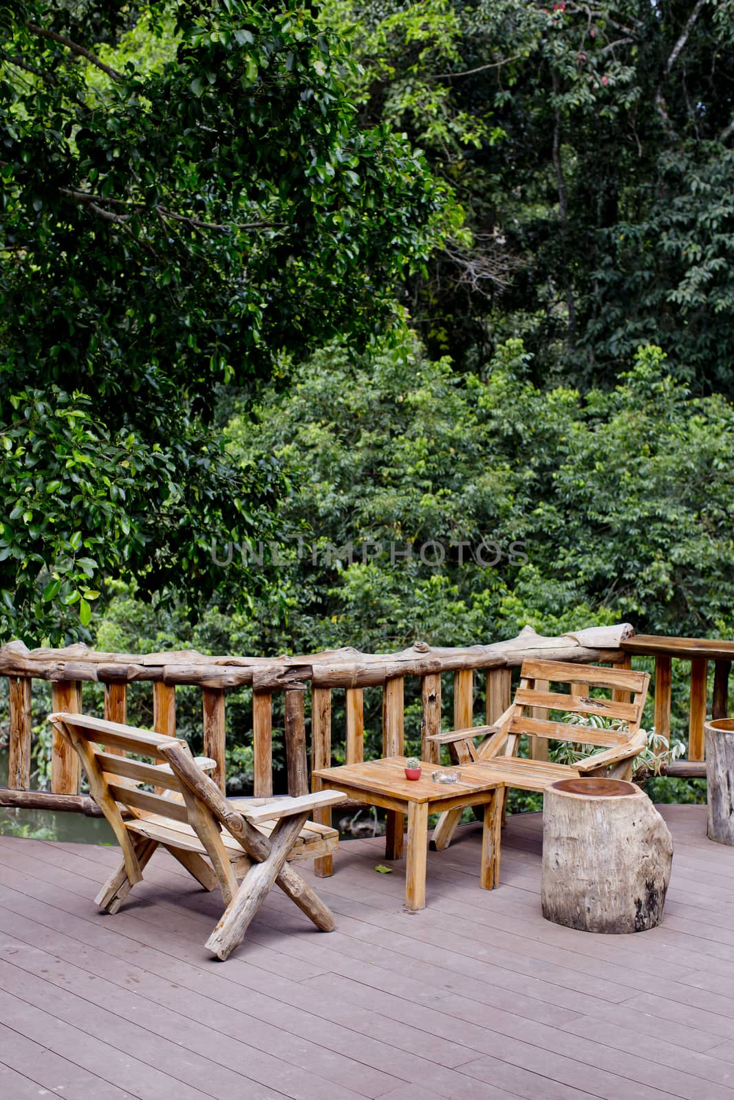 Outdoor bench and view of forest