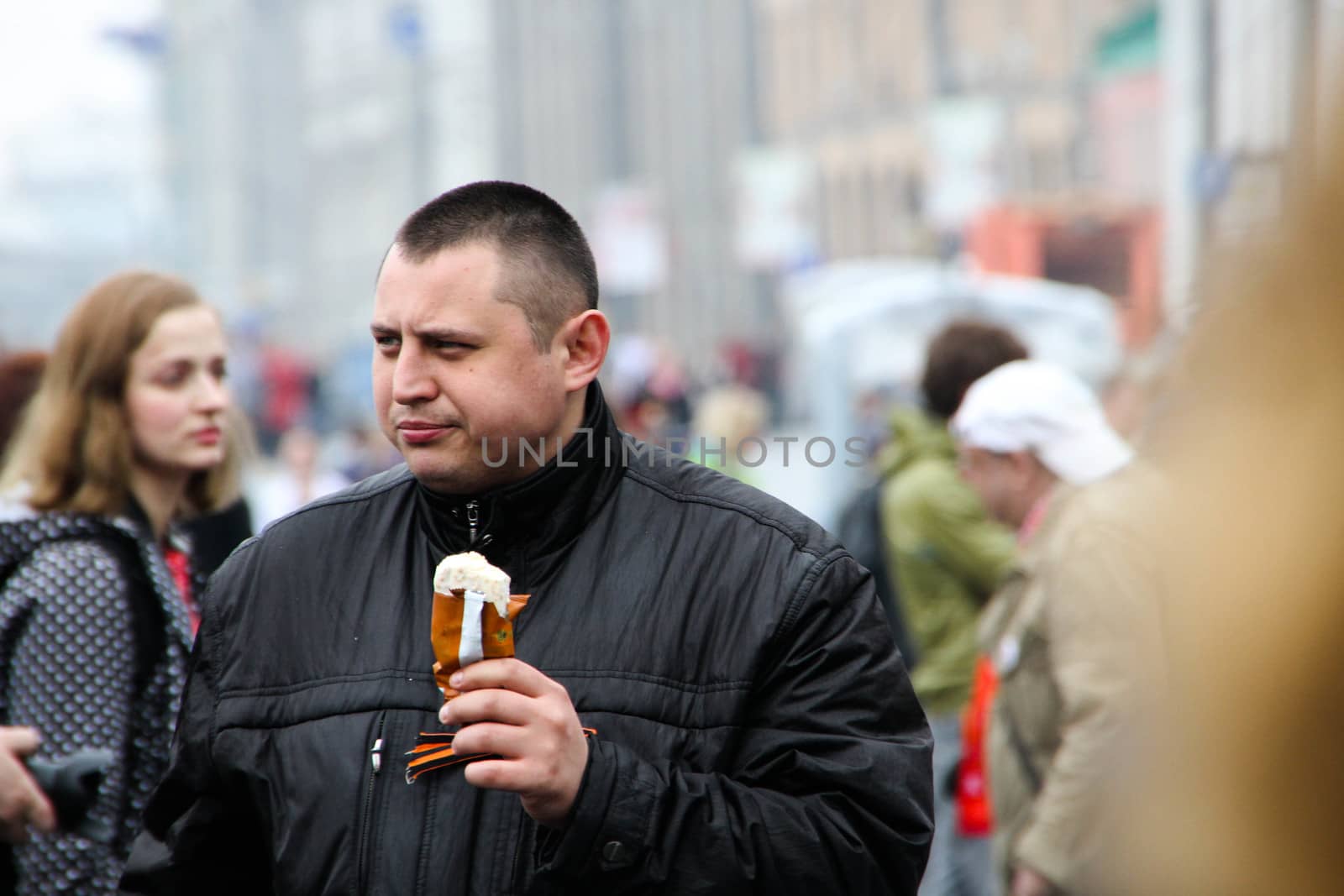 Moscow, Russia - May 9, 2012. March of communists on the Victory Day. Police officer of the Center for fight against extremism Alexey Okopny