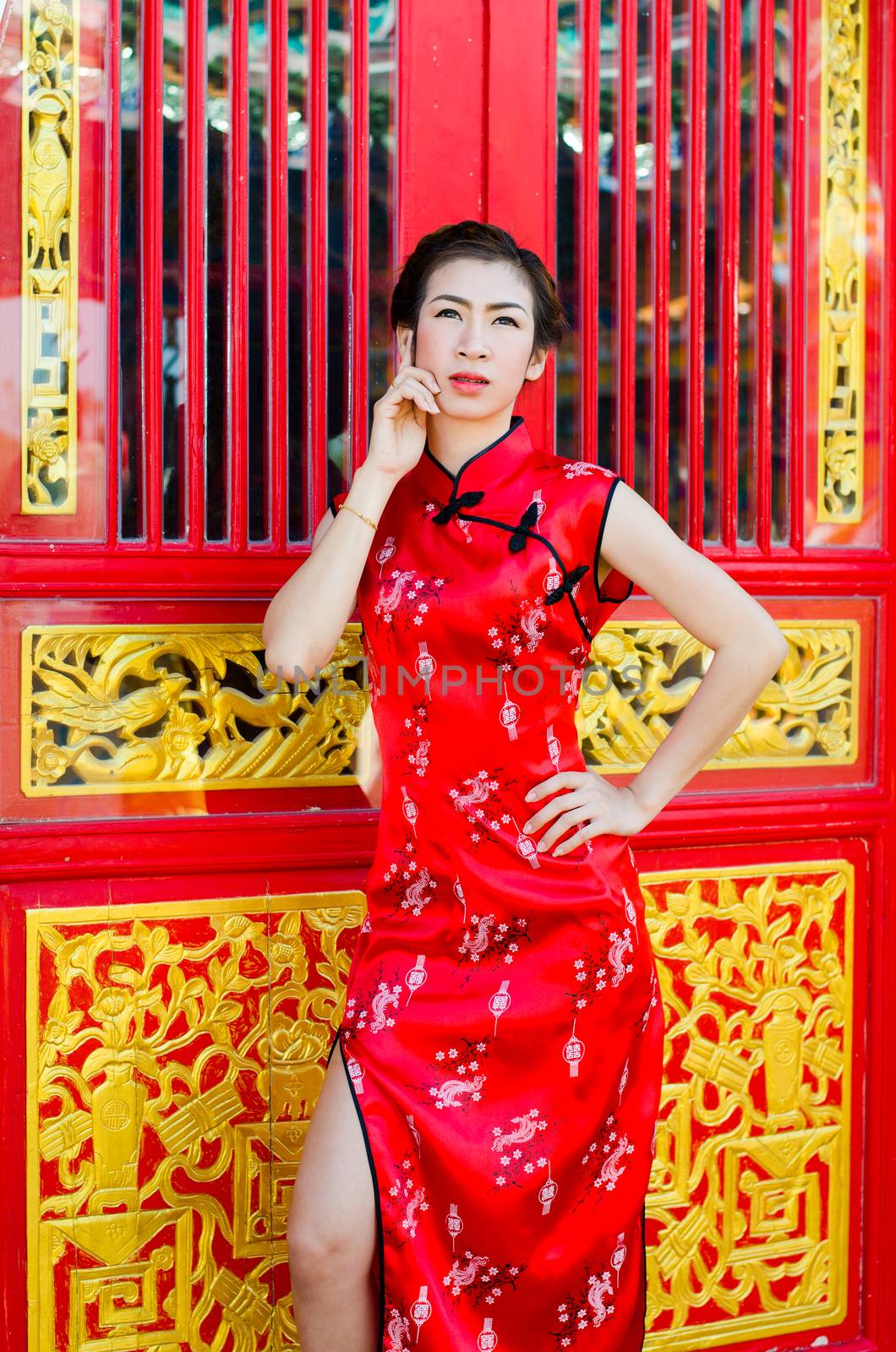 Woman in red dress,Cheongsam dress of Chinese traditional.