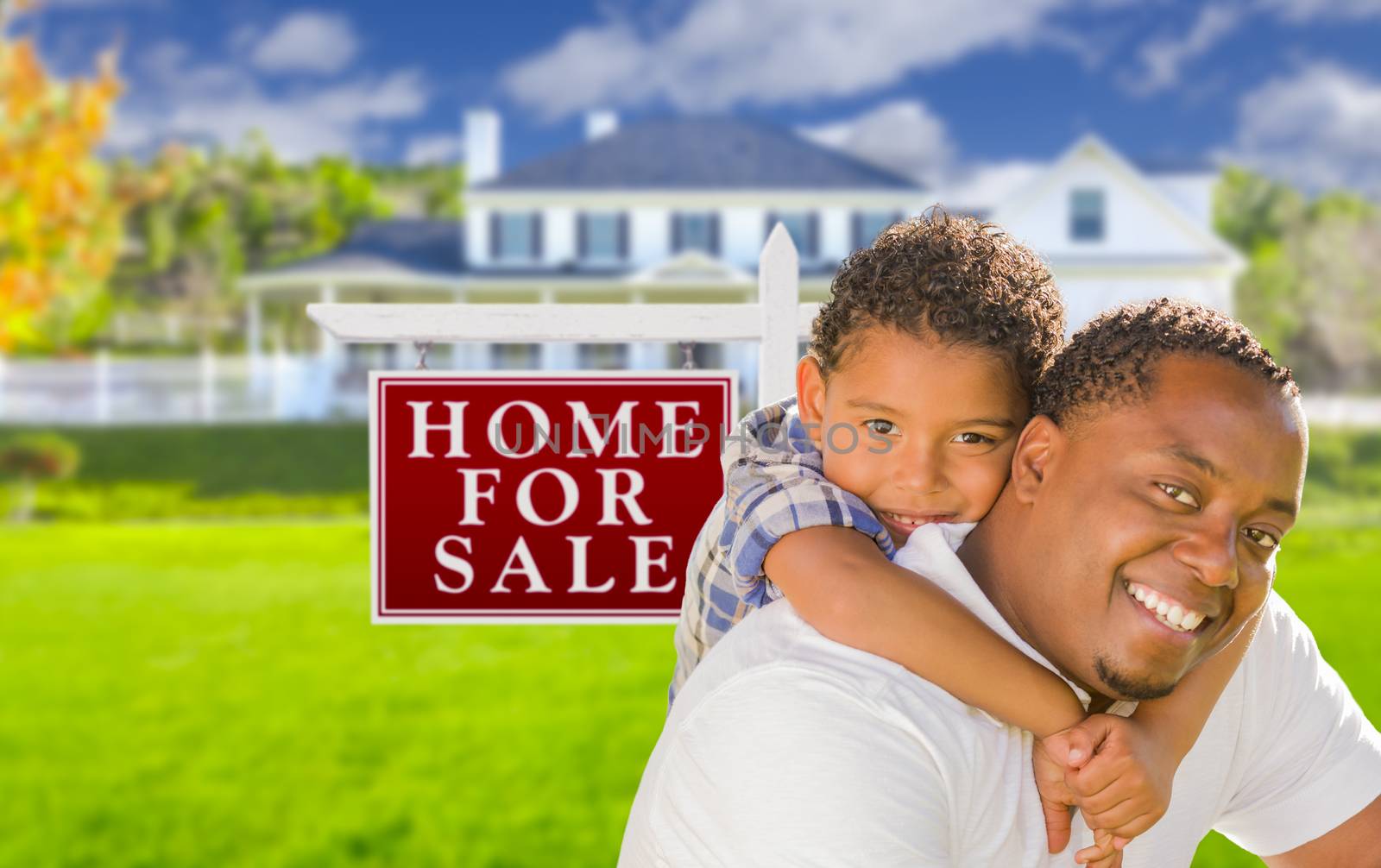 Father and Son In Front of Sale Sign and House by Feverpitched