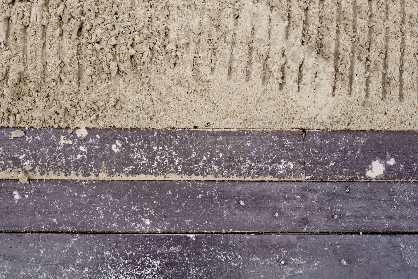 wooden boards against sandy background