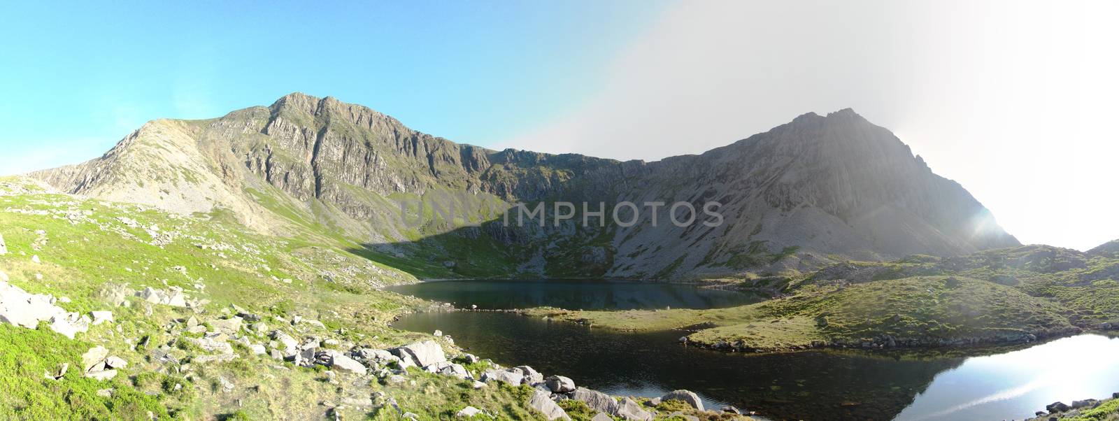 Panorama at Llyn-y-Gadair on cadair idris mountain in snowdonia by chrisga