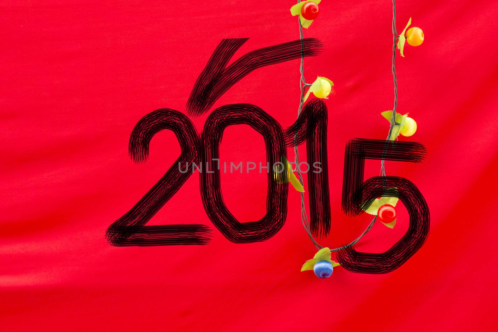 Chinese Calligraphy 2015 Year of the Goat 2015 on red silk fabric background