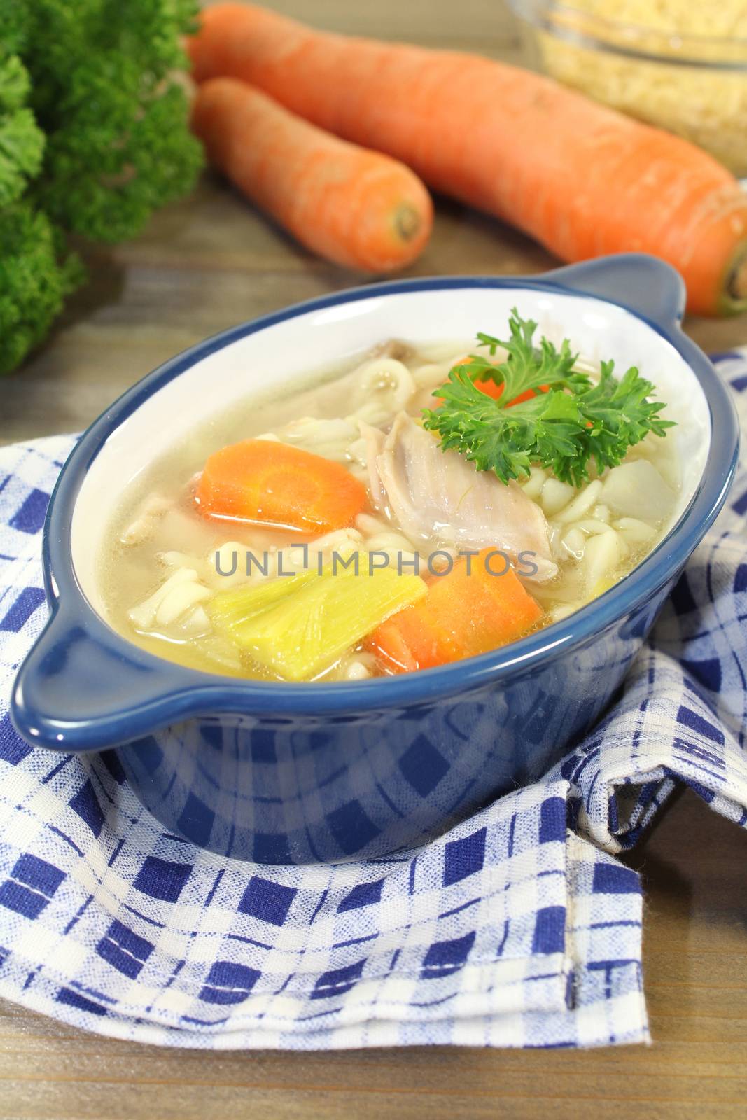 Alphabet soup with vegetables and chicken meat