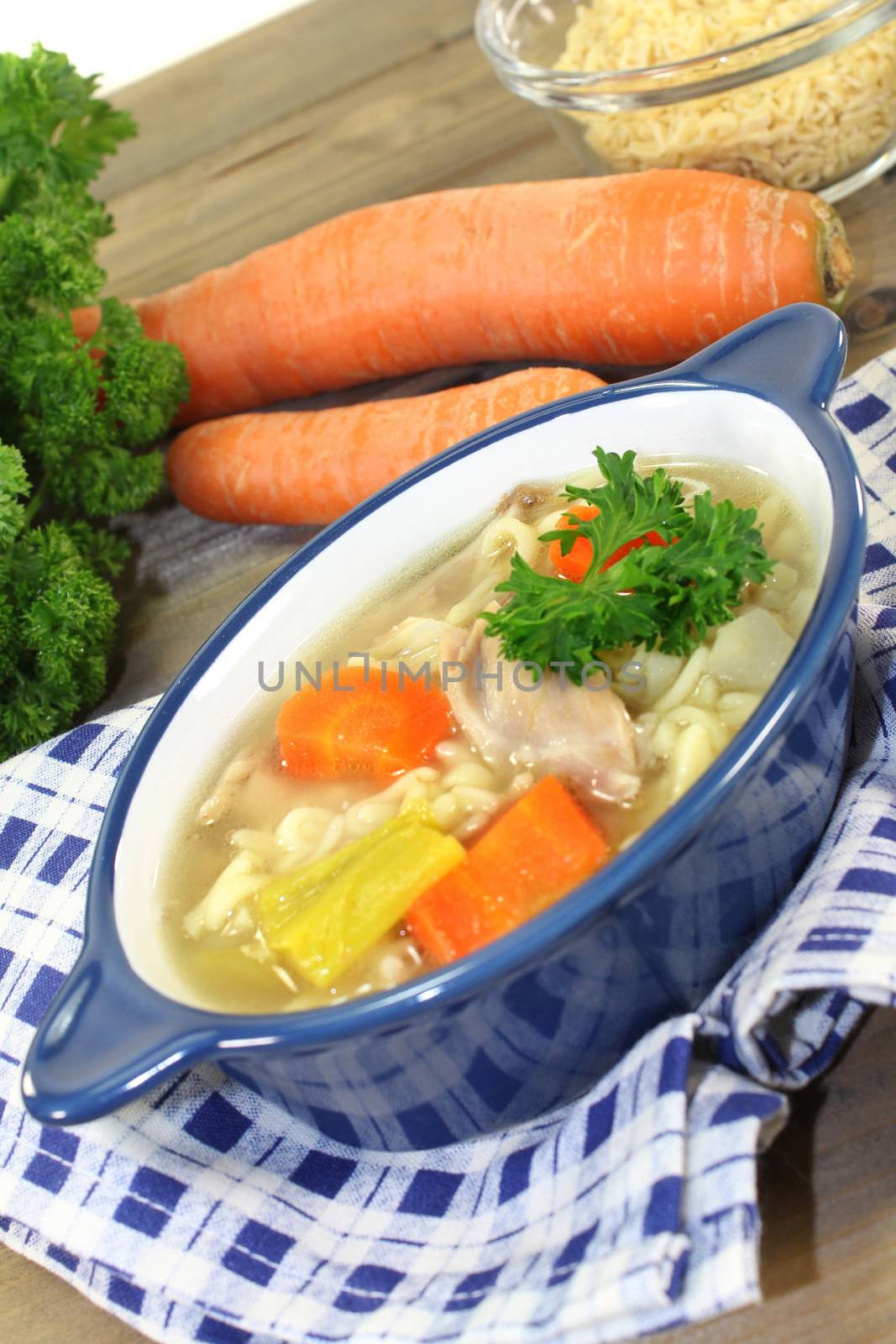 Alphabet soup with vegetables and chicken meat