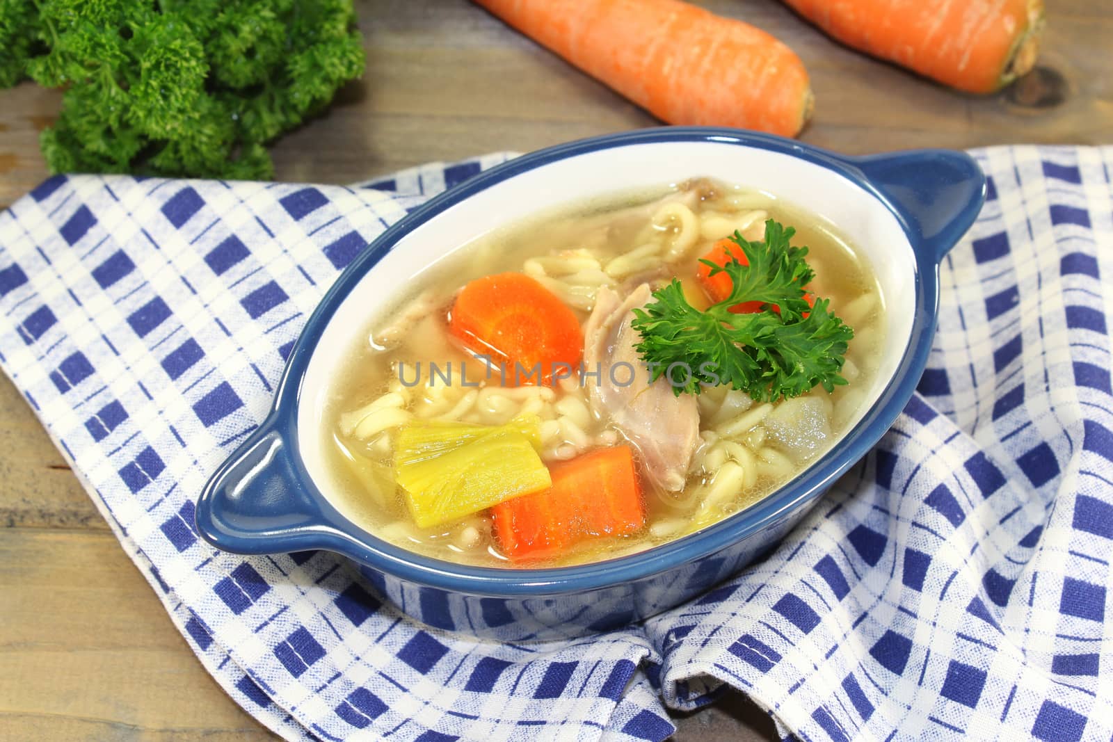 Alphabet soup with vegetables and chicken meat