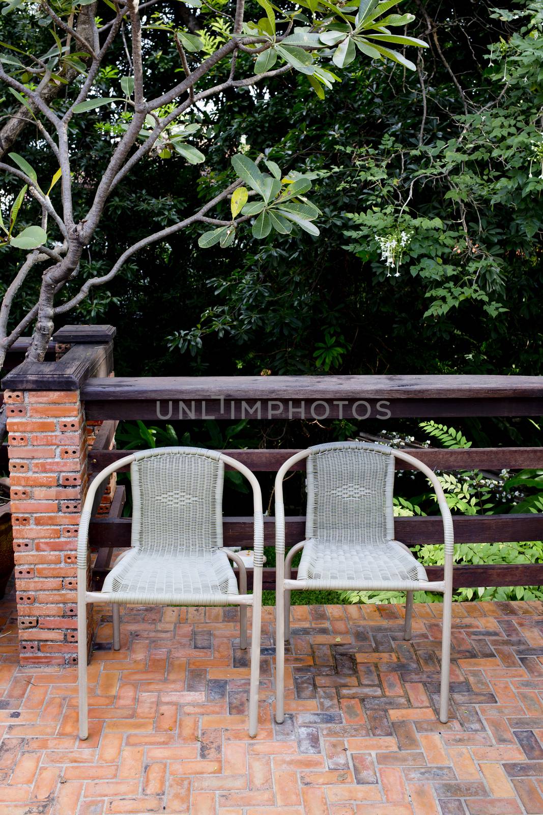 Out door couple of rattan chairs.