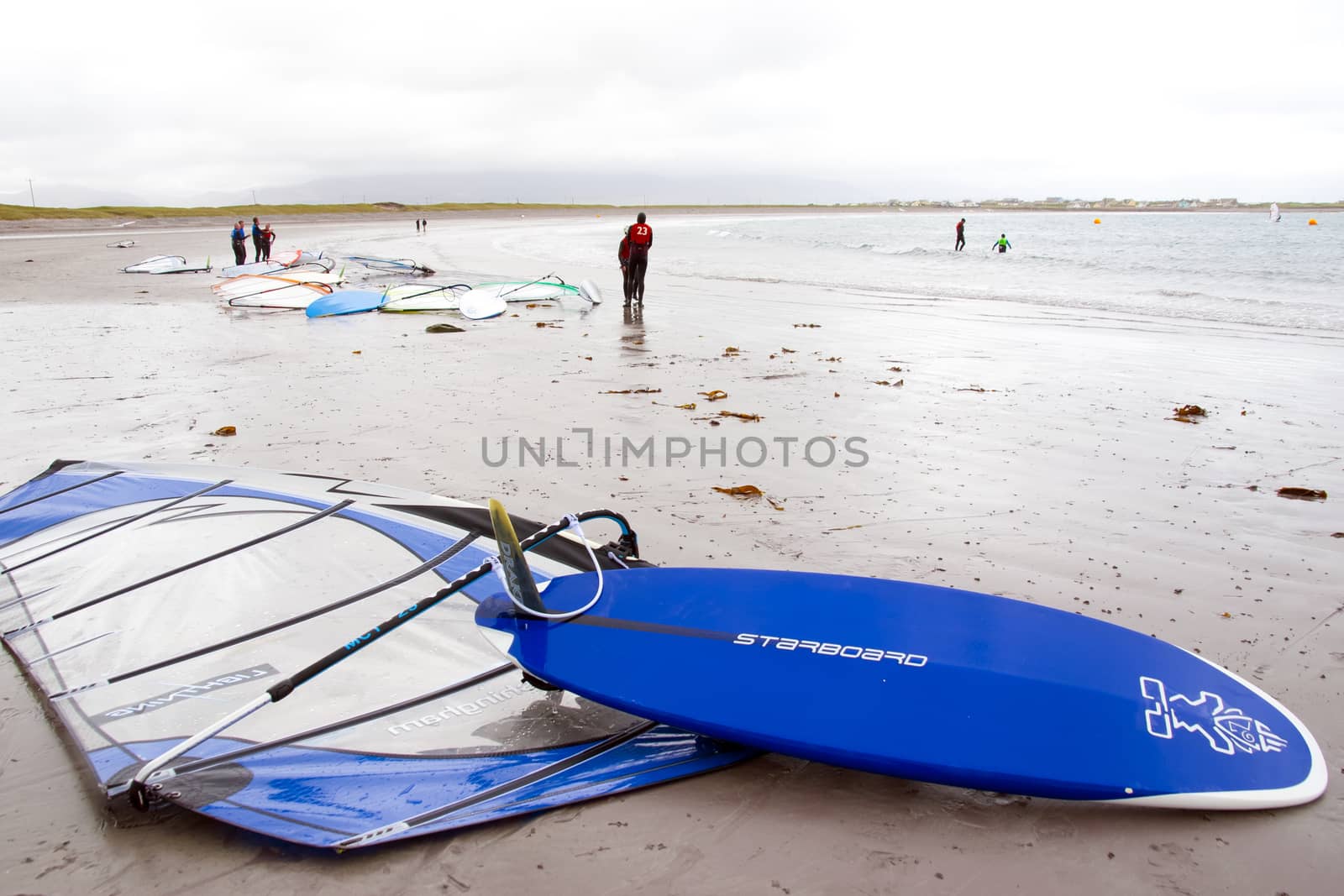 windsurfing champion getting ready to race and surf on the beach in the maharees county kerry ireland