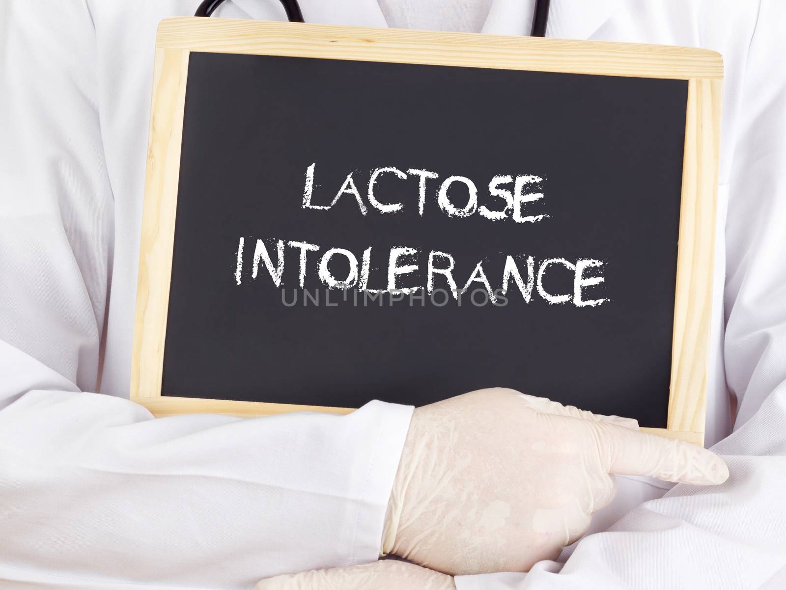 Doctor shows information on blackboard: lactose intolerance