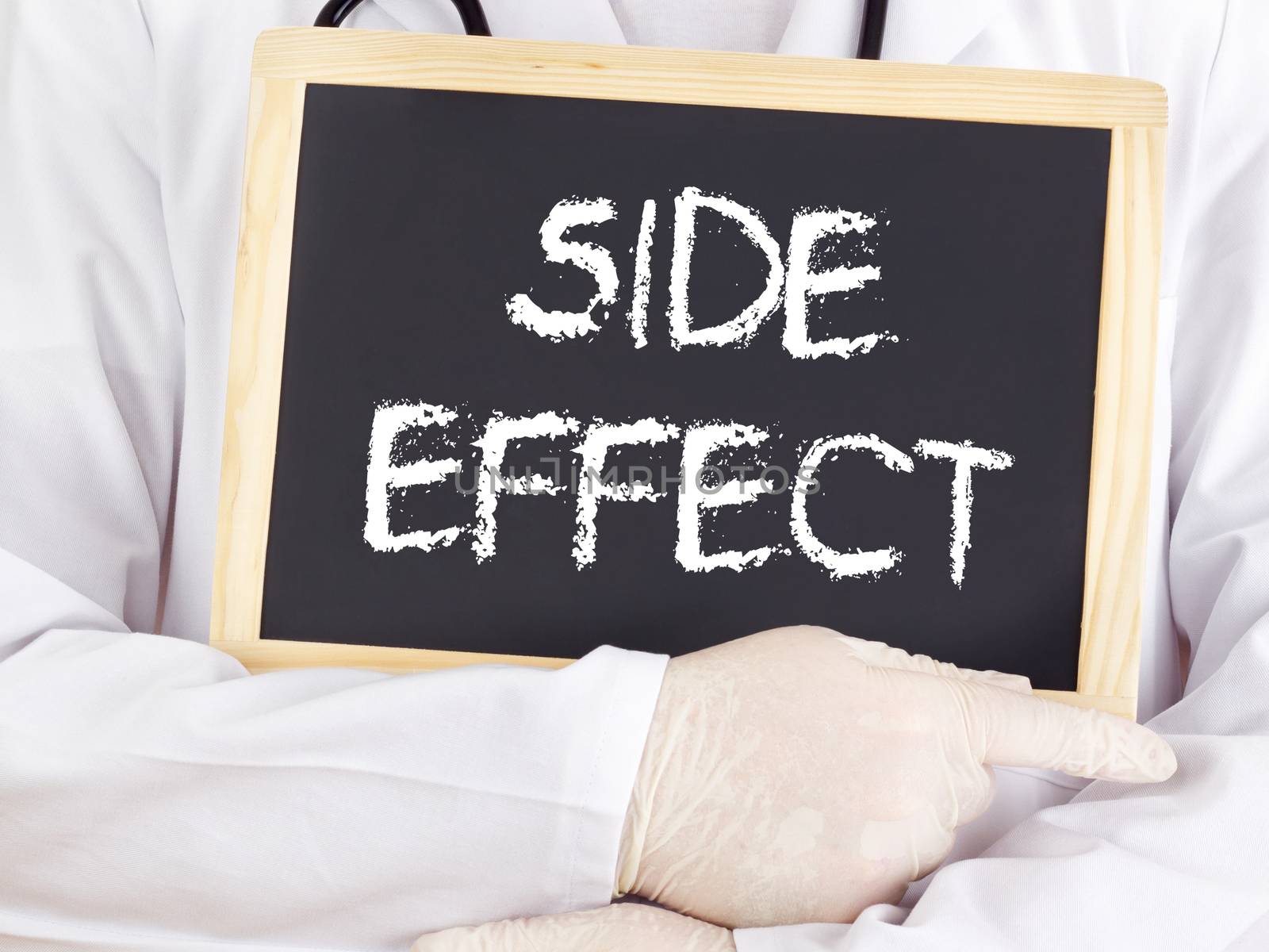 Doctor shows information on blackboard: side effect by gwolters