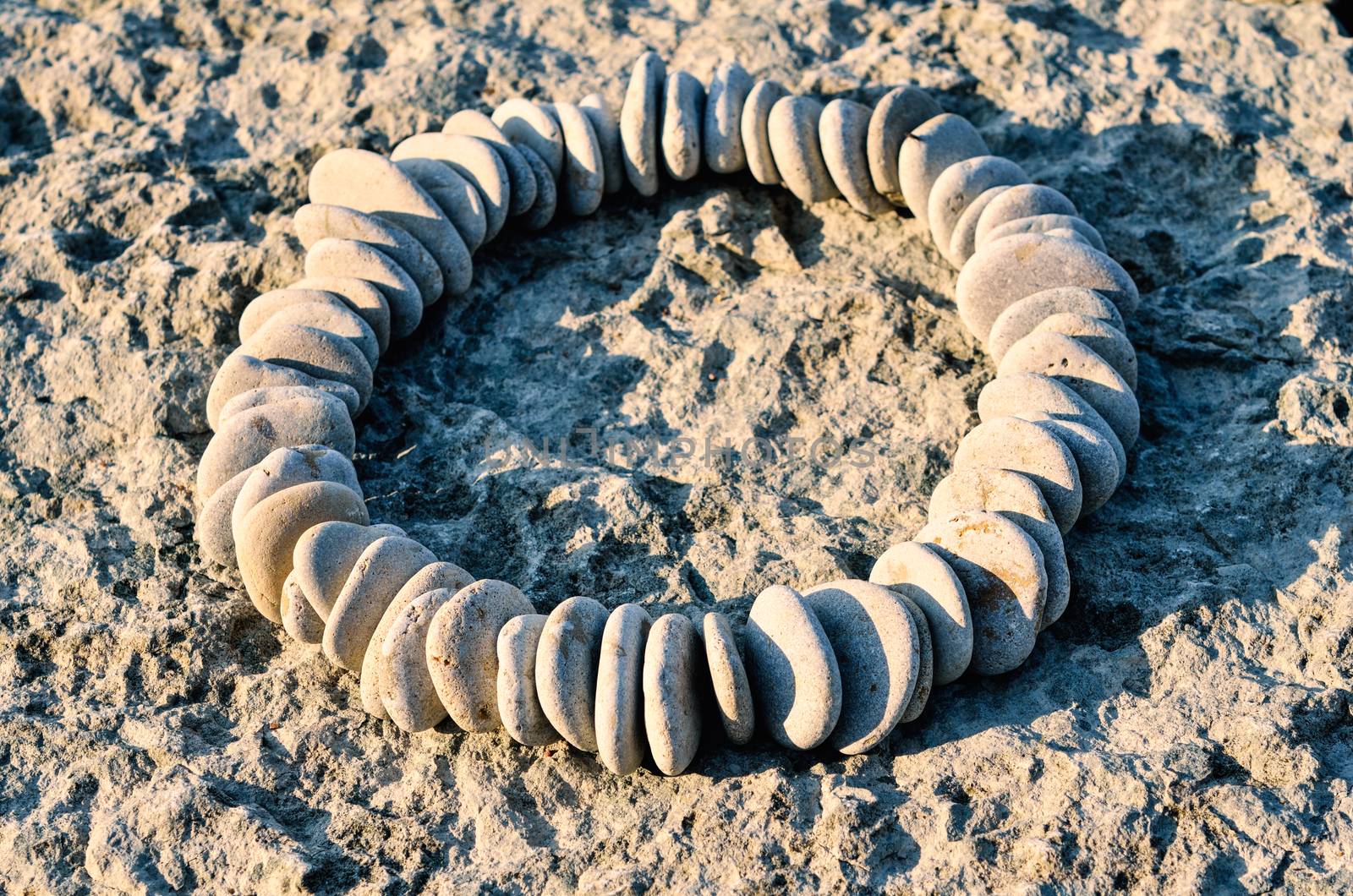 Sequence of small stones laid out in the form of a circle