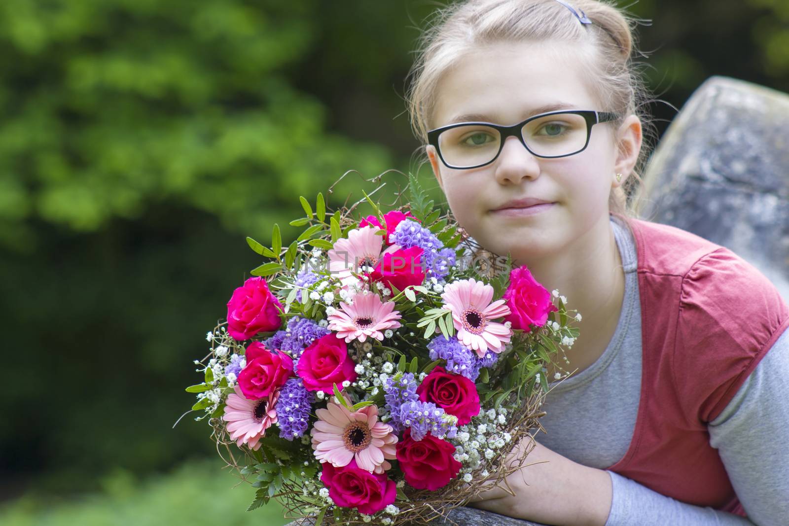 cute young girl with flowers - gift for the mother by miradrozdowski