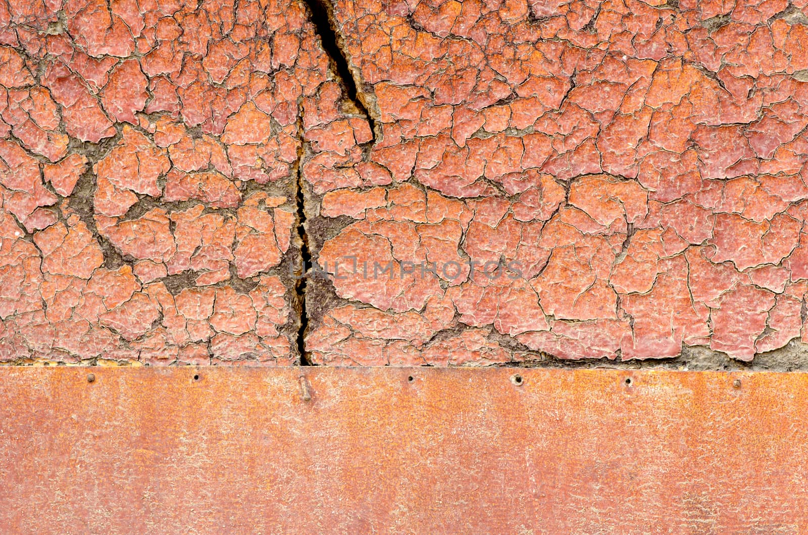 Old orange damaged surface of wooden and iron desk.