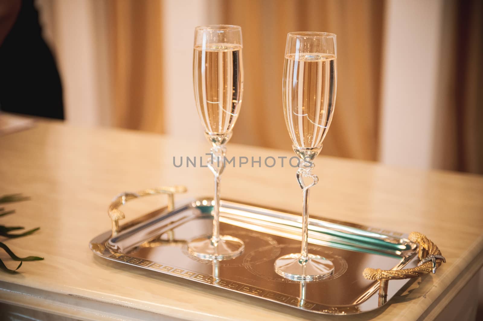 wedding champagne glass with hearts  full of drink