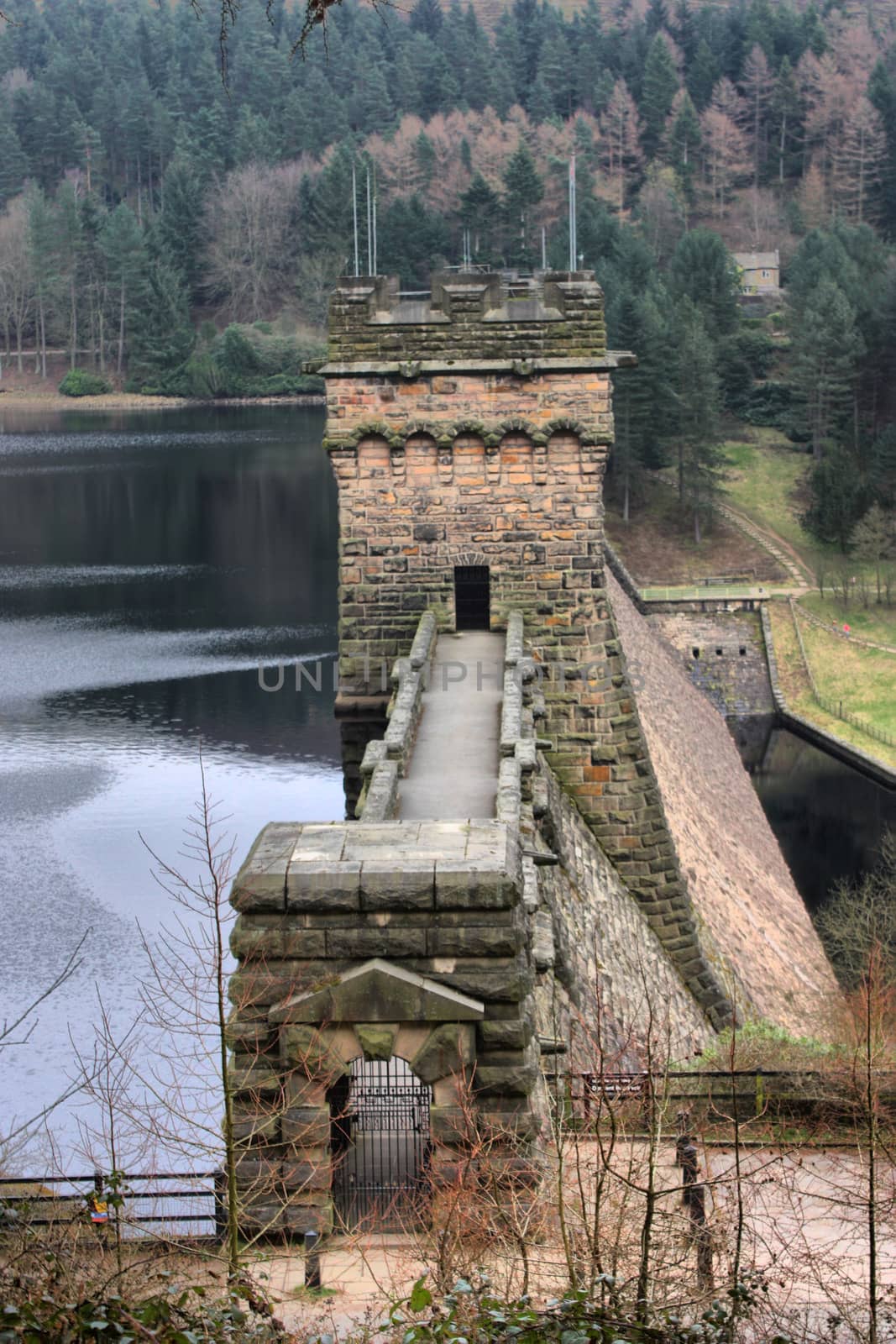 derwent reservoir dam breakwater under a cloudy sky by chrisga