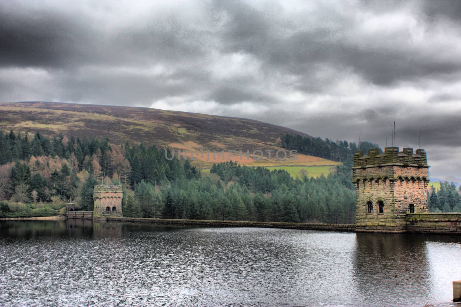 derwent reservoir dam breakwater under a cloudy sky by chrisga