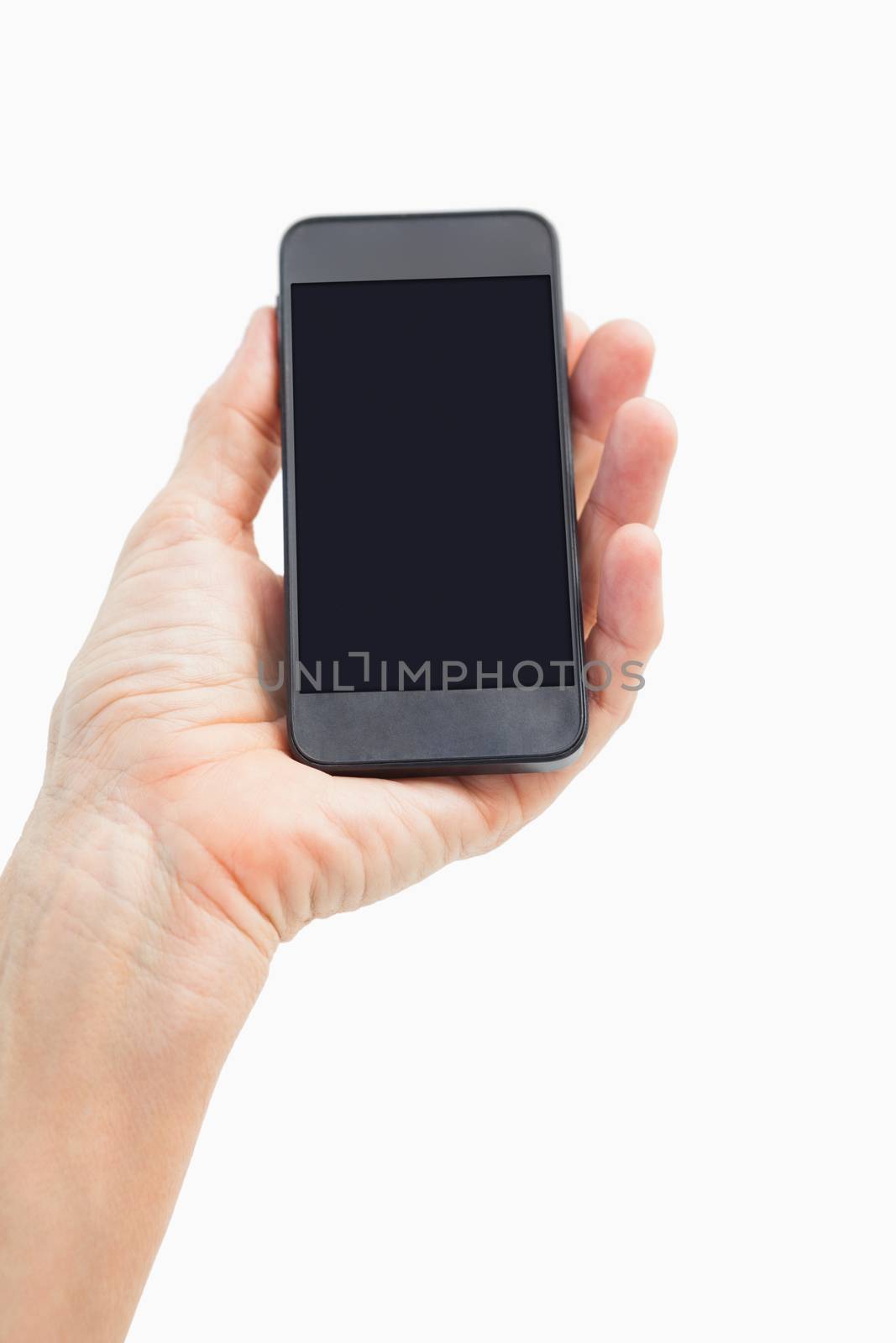 Woman showing black smartphone screen on white background