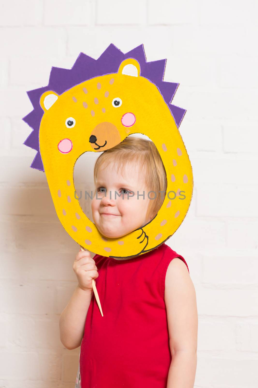 Little girls holding hedgehog mask on white background by sarymsakov