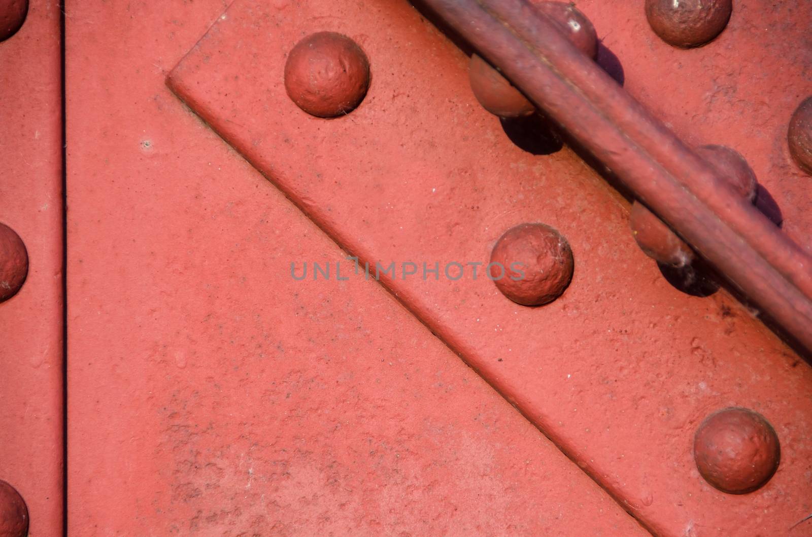 Oxide red iron bridge construction, texture detail.