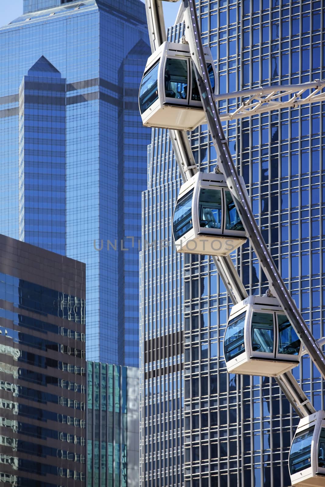 Ferris wheel on a background of tall buildings in HONG KONG