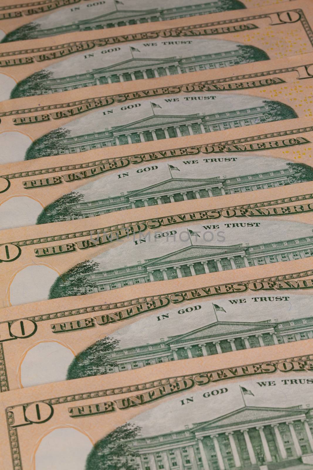 Detail of the same pattern of dollar bills on the table