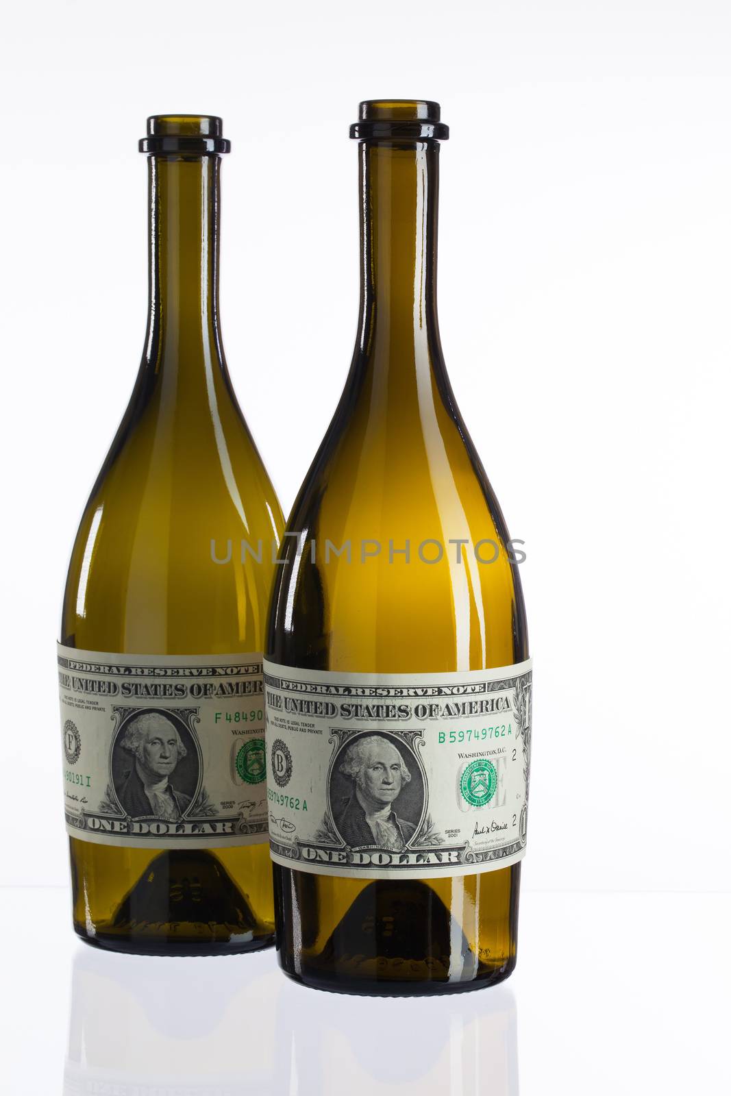 Empty bottles of wine from the label of dollar bill  by CaptureLight