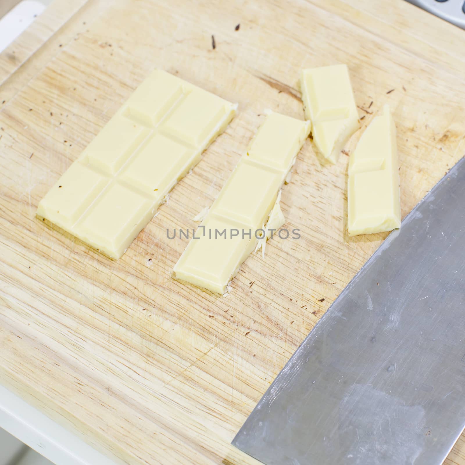 white chocolate piled up on a cutting board