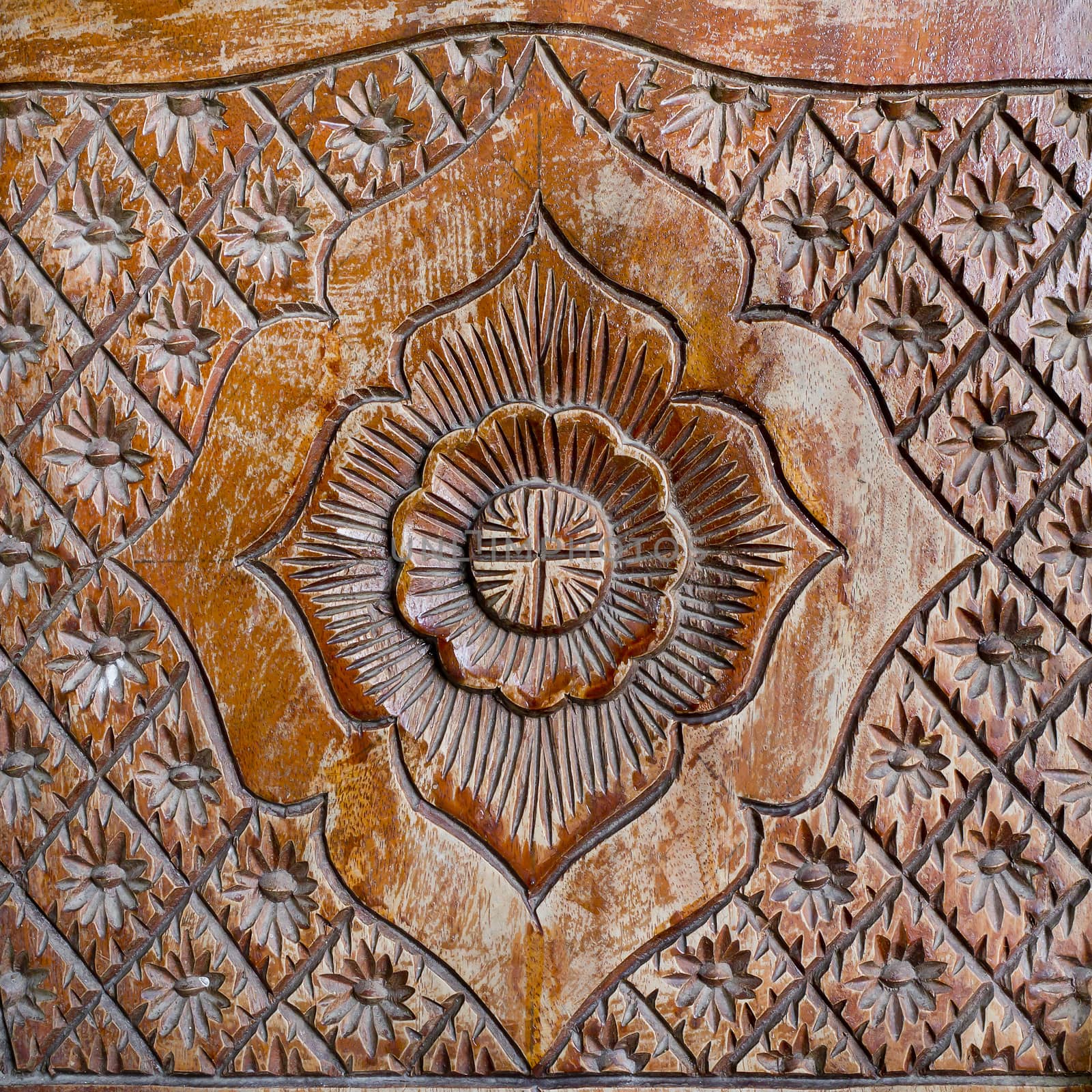 Pattern of flower carved on wood background